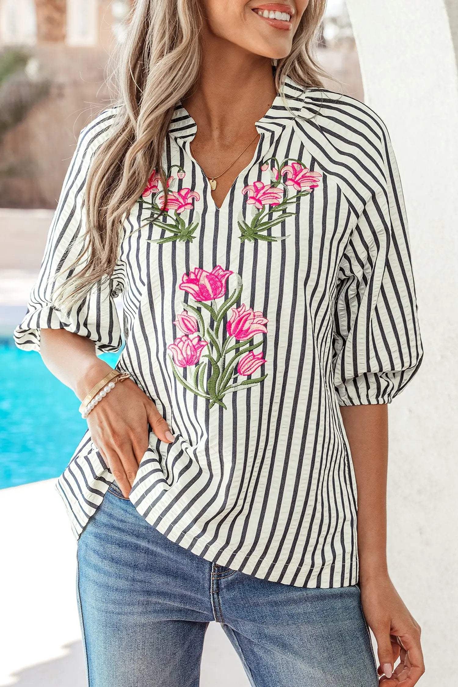 Woman wearing Cool Mom Energy floral embroidered stripe V-neck short sleeve blouse