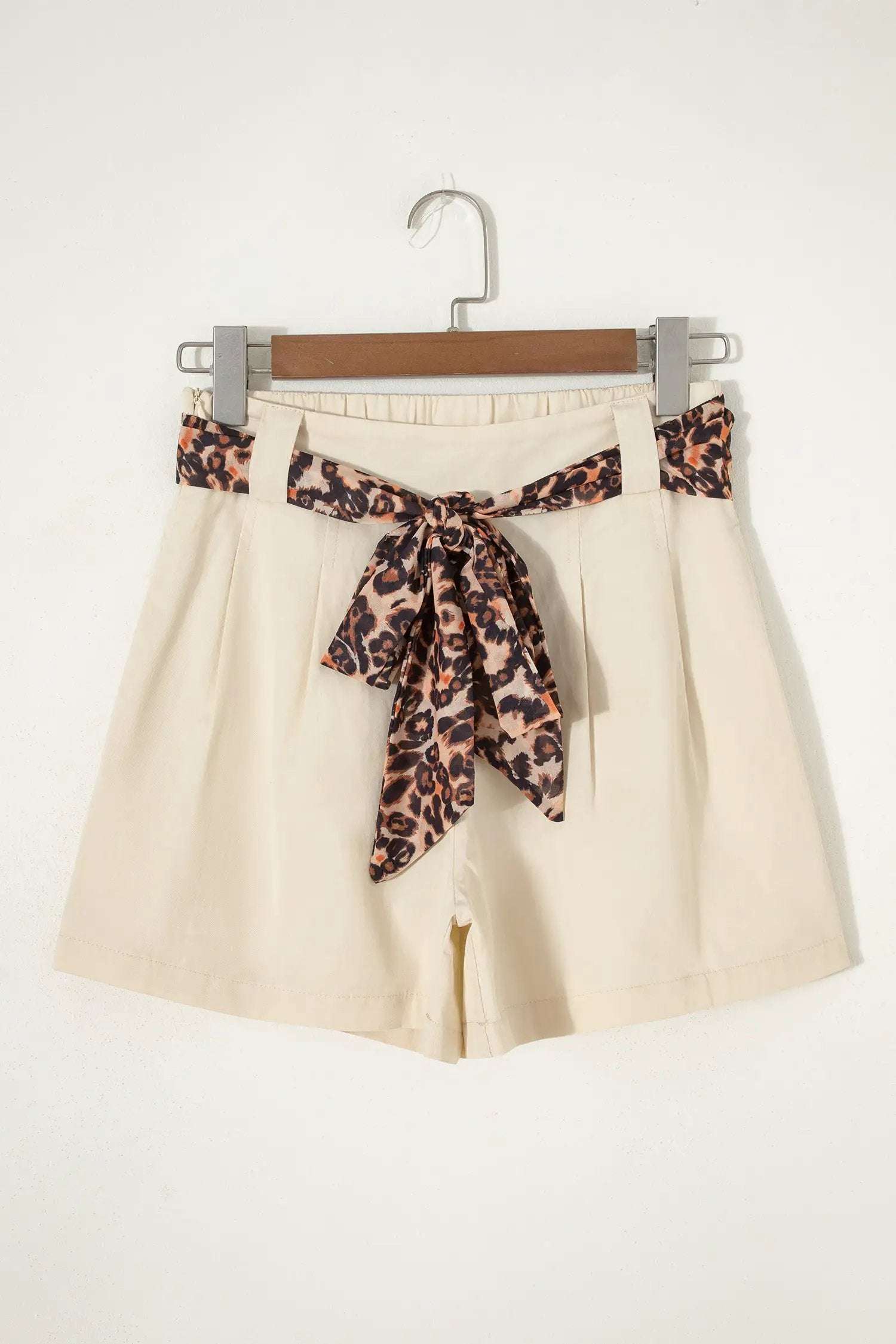Pink pleated wide-leg shorts with leopard contrast sash belt for weekend vibe style