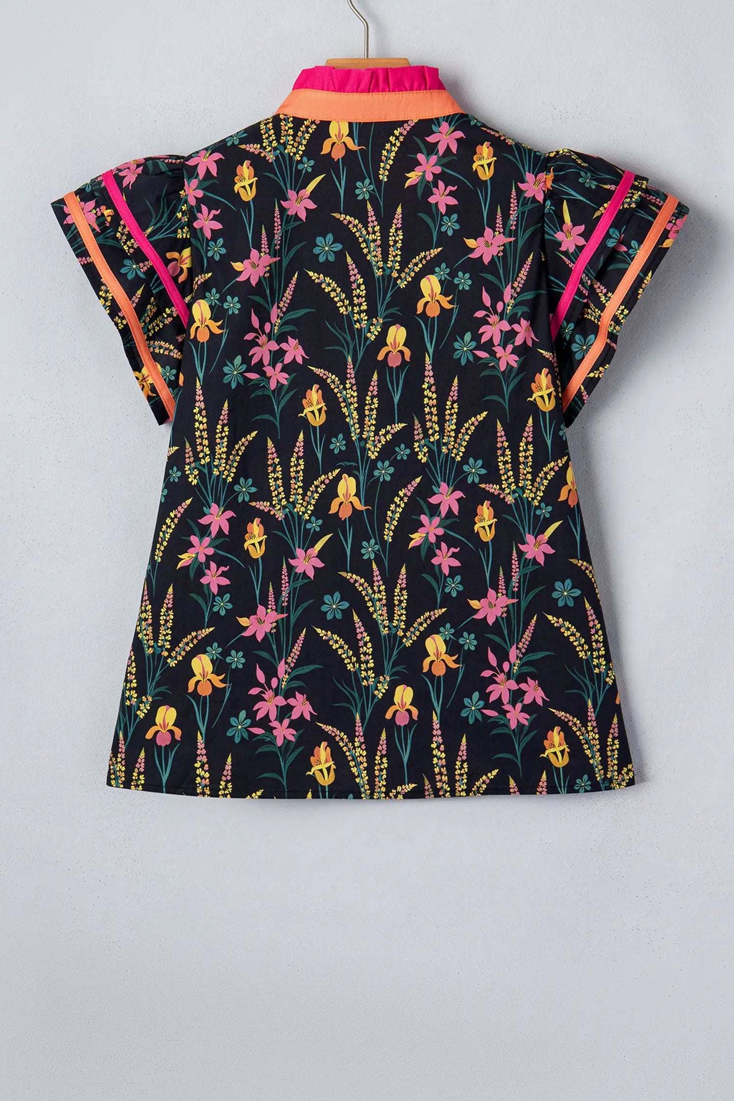 Black floral print tiered blouse with short flutter sleeves and contrast trim neckline