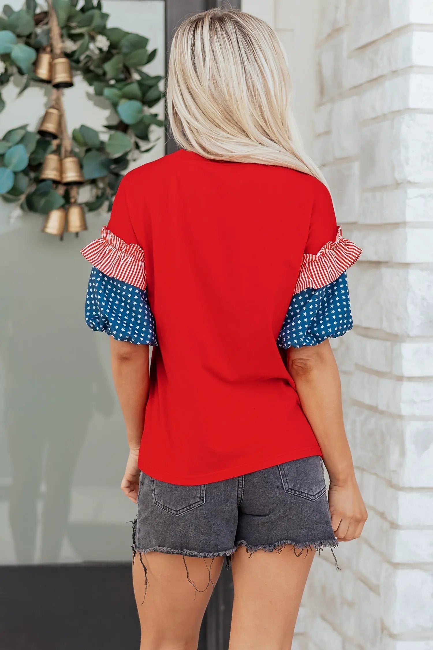Fiery red stars stripes patriotic puff sleeve top with American flag print and sky-blue bodice