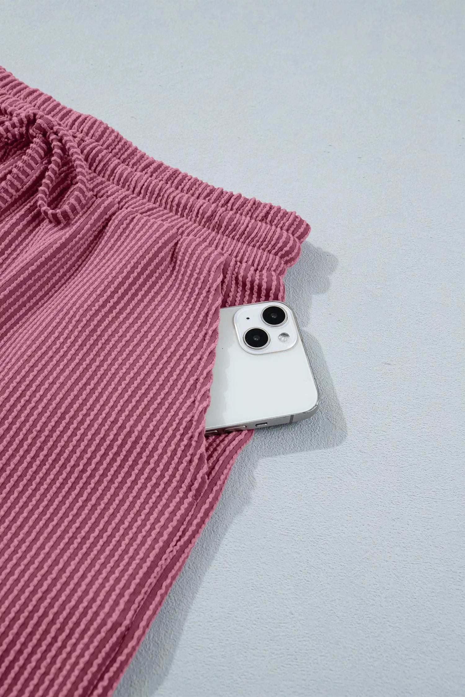 Soft pink twisted ribbed two-piece set with loose tee and shorts for casual mom style