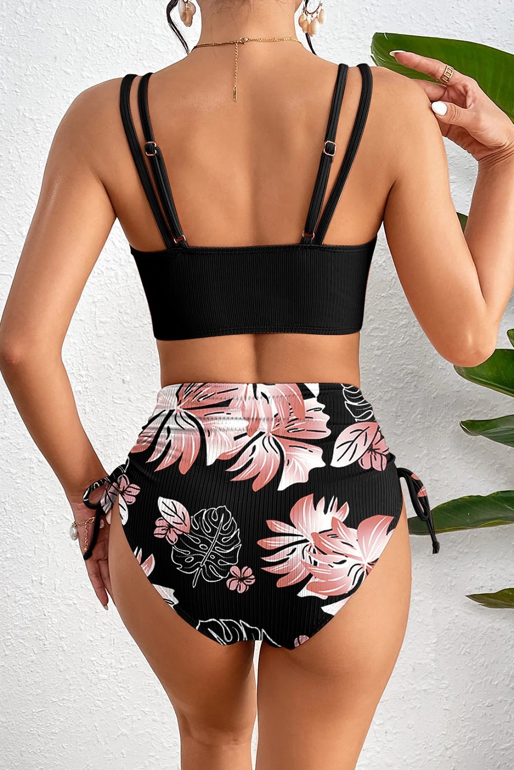 Black ribbed knit two-piece bikini with floral high-waist bottom and double-strap top
