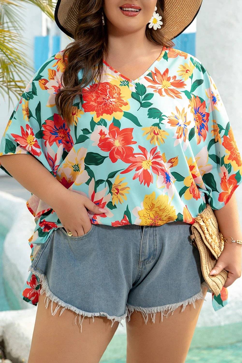 Plus size Coastal Bloom floral print V neck batwing sleeve blouse on model