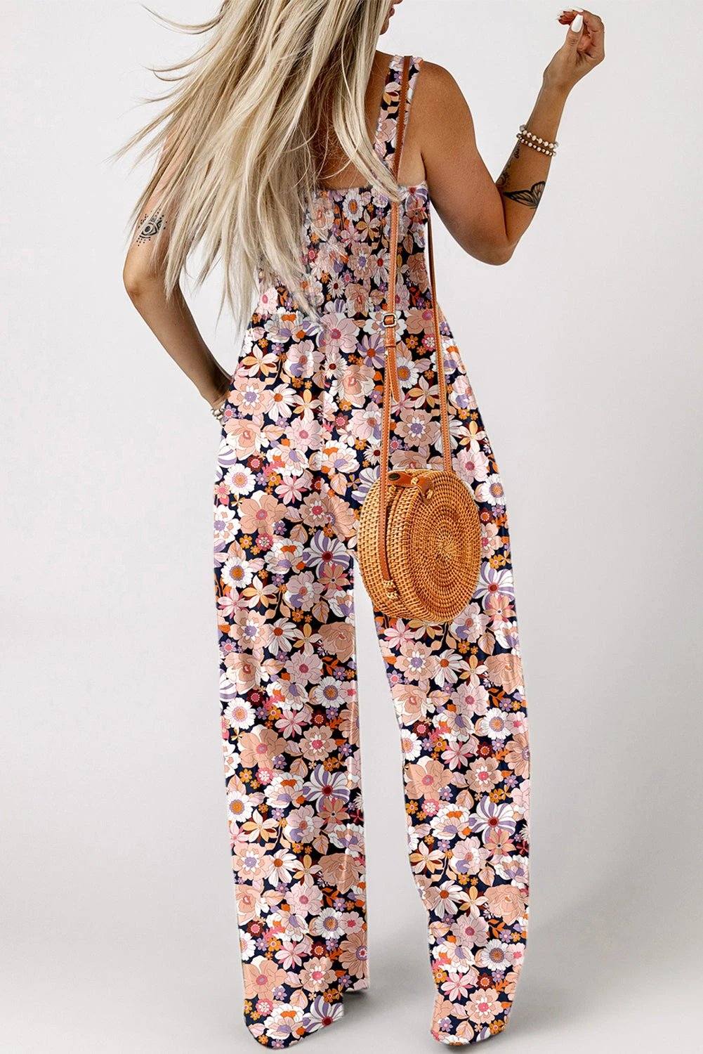 Boho Chic floral smocked square-neck jumpsuit with wide-leg silhouette and dark floral print