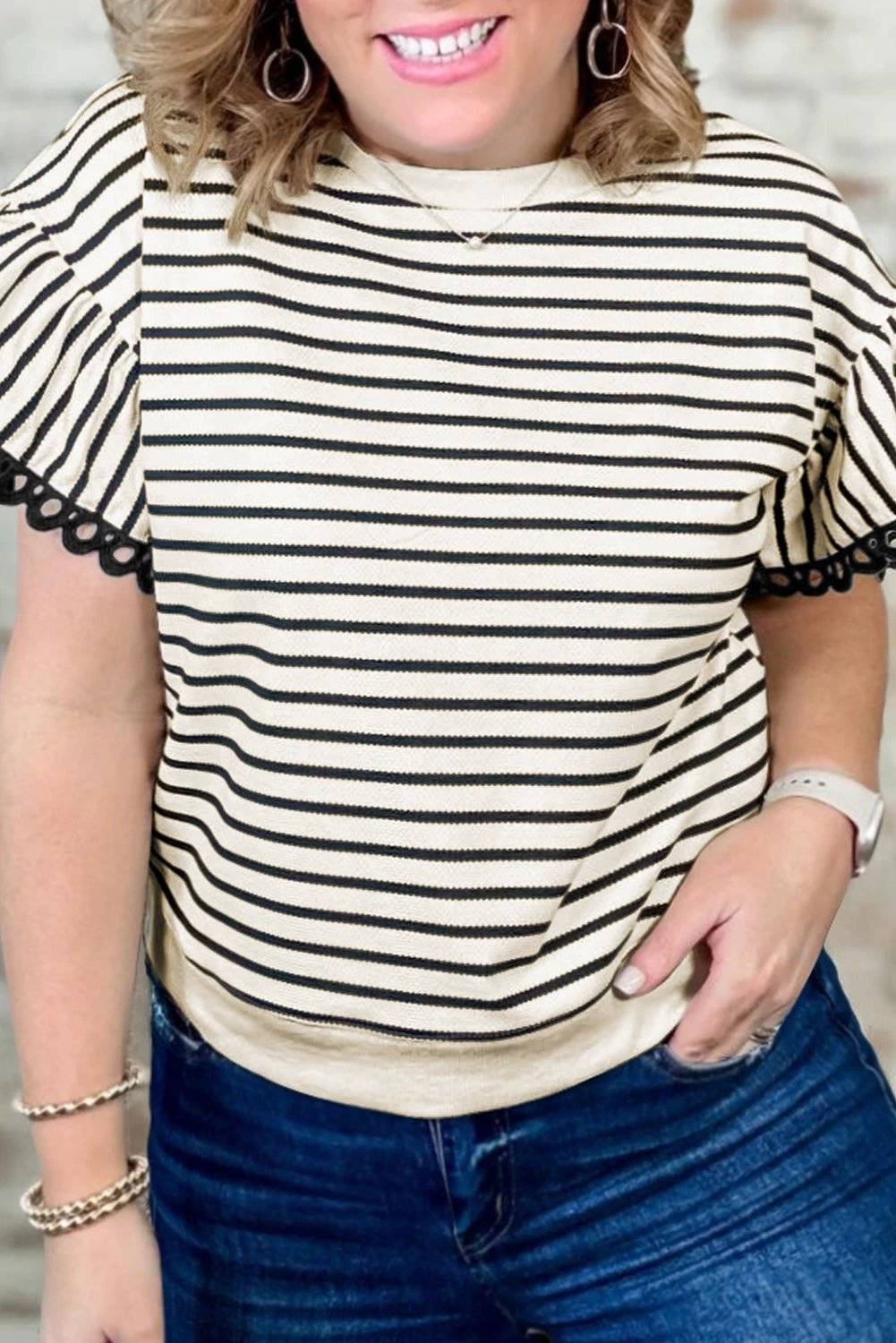 Plus size black stripe eyelet trimmed ruffled short sleeve top with creamy base