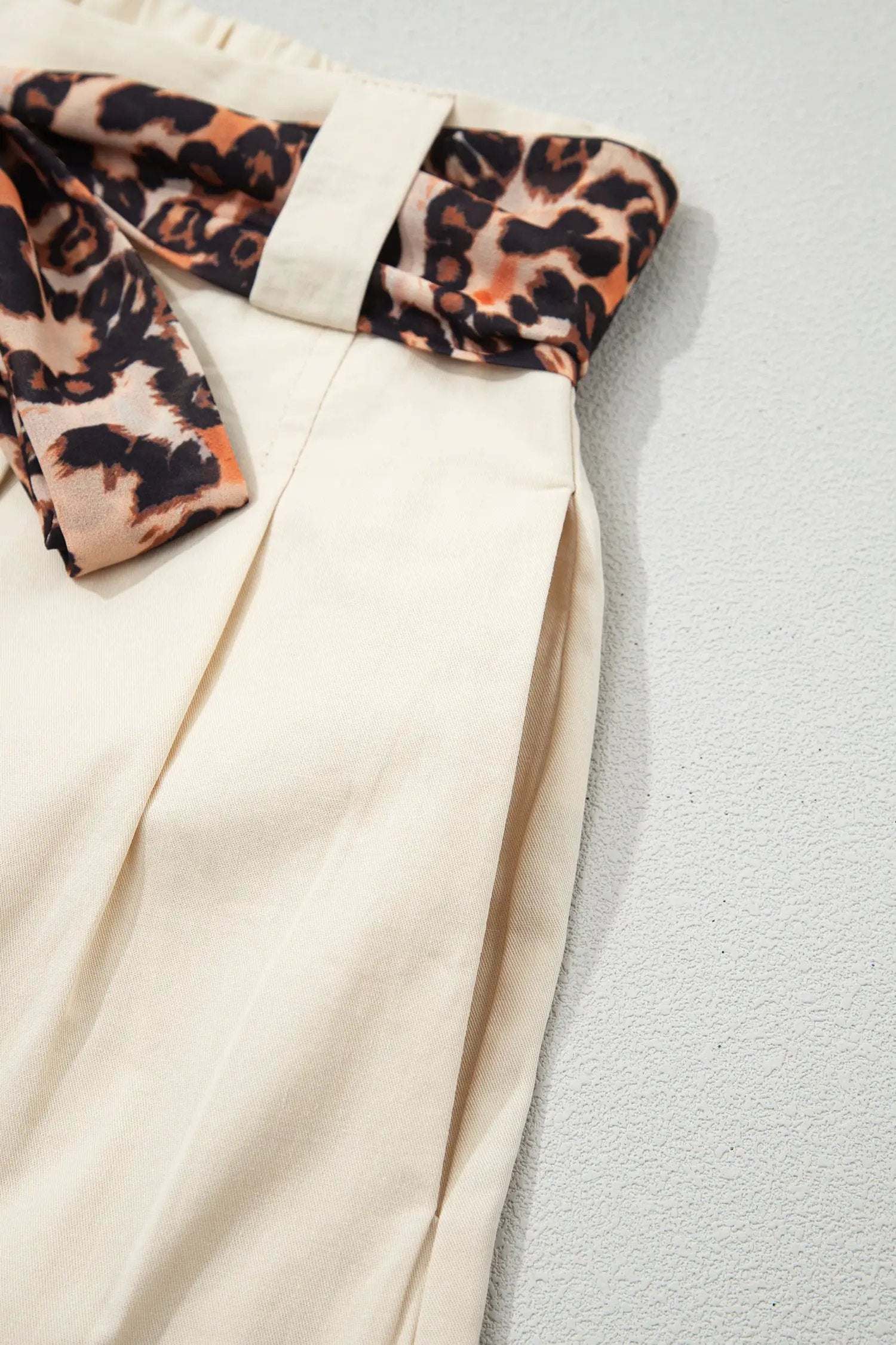Pink pleated wide-leg shorts with leopard contrast sash belt from Weekend Vibe collection