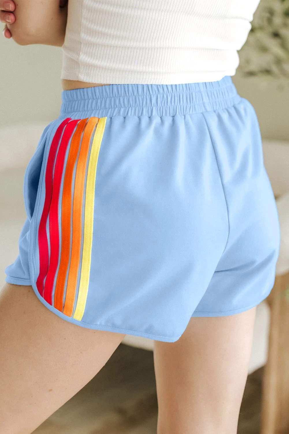 Pink high waist active shorts with color block stripes and elastic waistband
