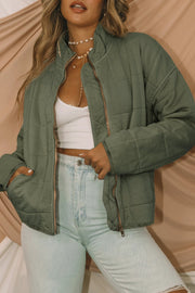 green zip-up pocket quilted jacket for women casual everyday outfit