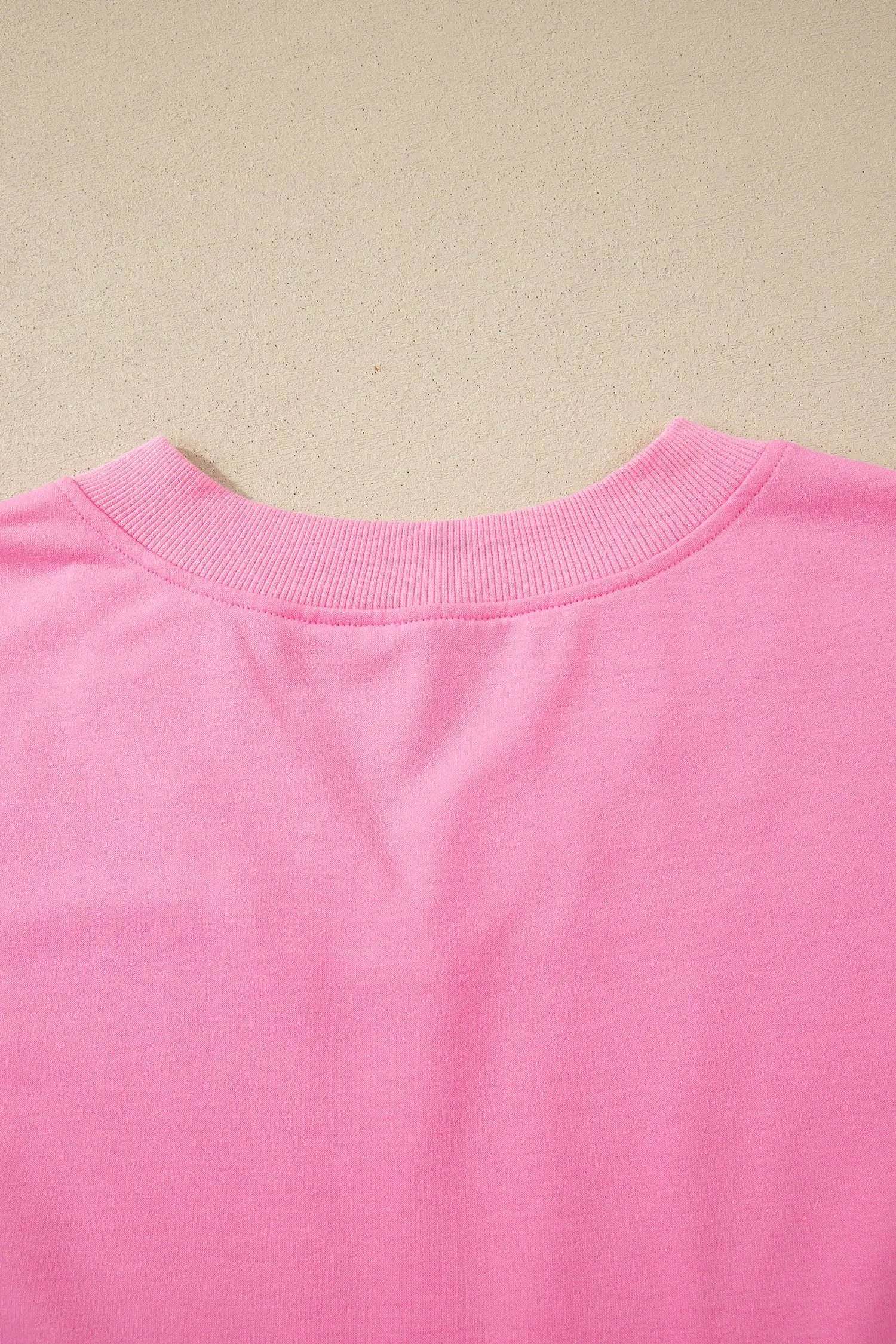 Pink Mom Chic two-piece outfit with V-neck top and drawstring shorts