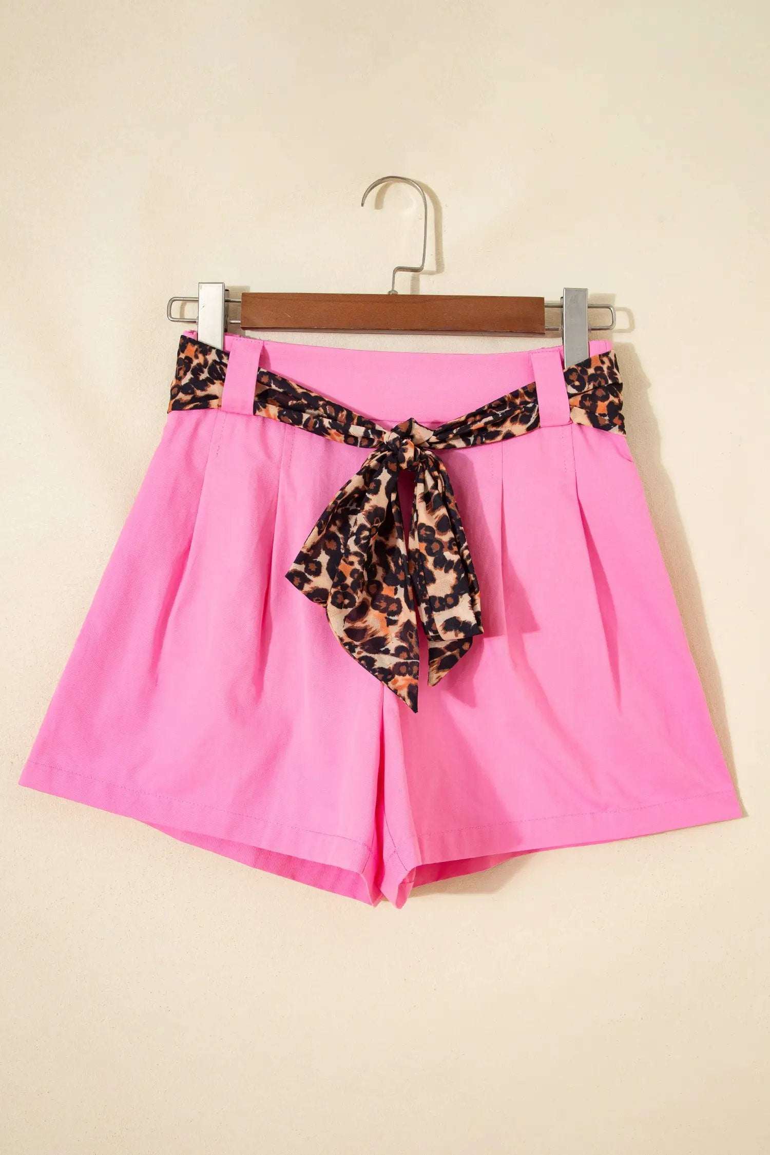 Pink pleated wide-leg shorts with leopard contrast sash belt for weekend vibe style