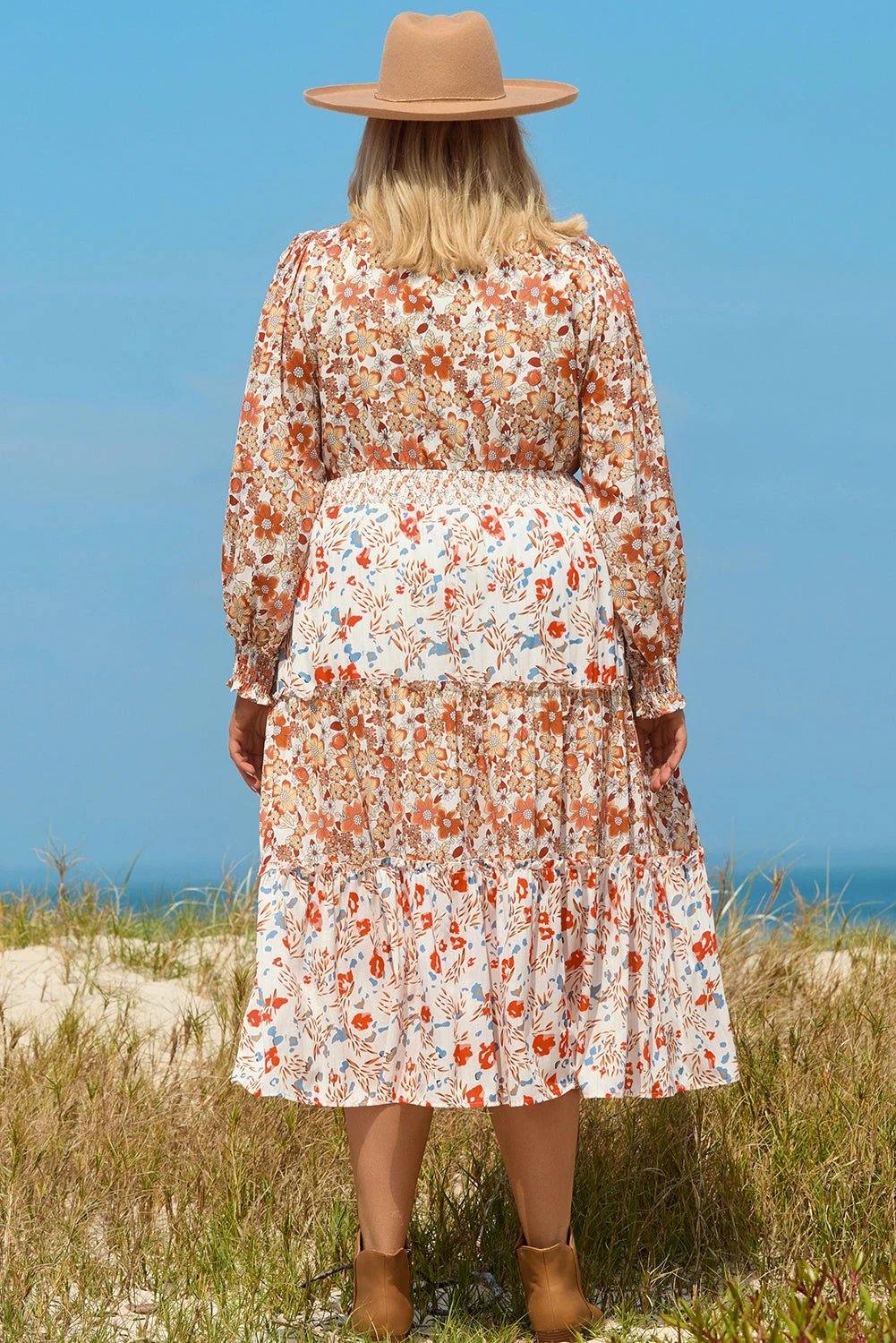 Plus size boho floral tiered ruffle maxi dress with long sleeves and flowing silhouette embodying main character energy