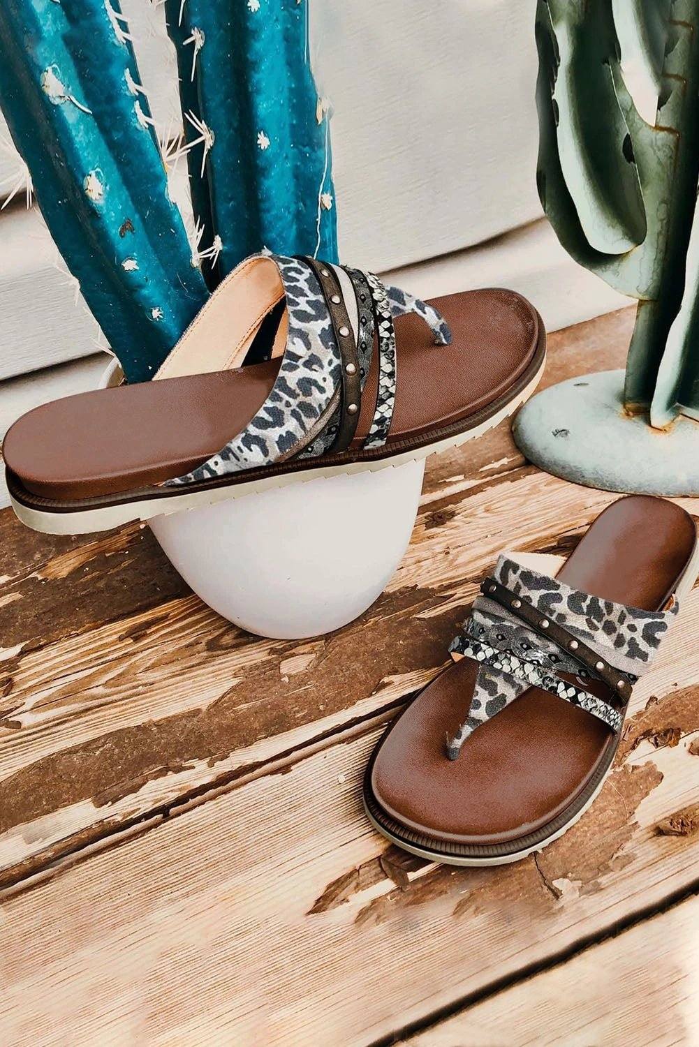 Leopard studded animal print flip flop sandals with cushioned footbed and multi-strap design