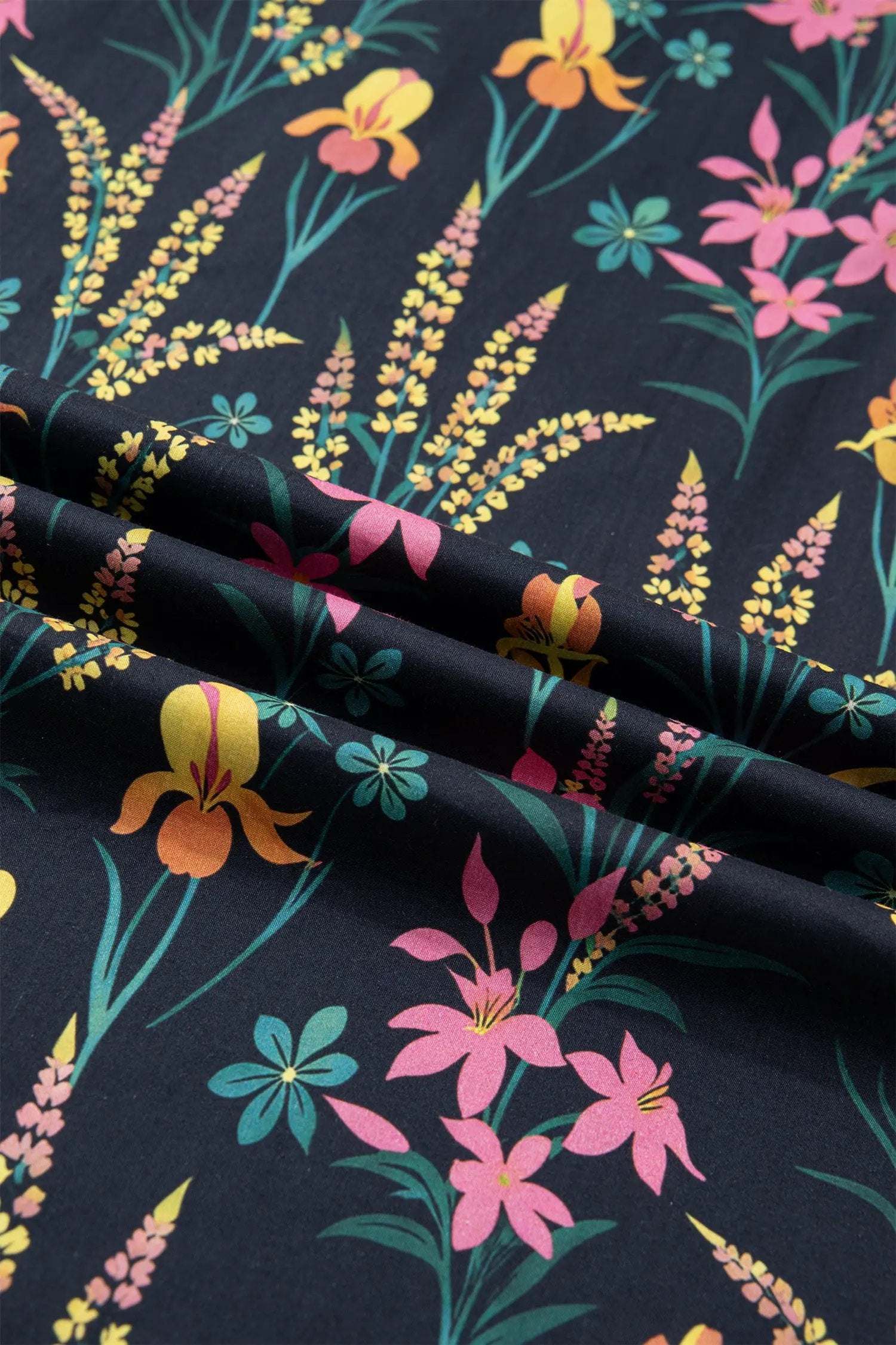 Black floral print tiered blouse with short flutter sleeves and contrast trim