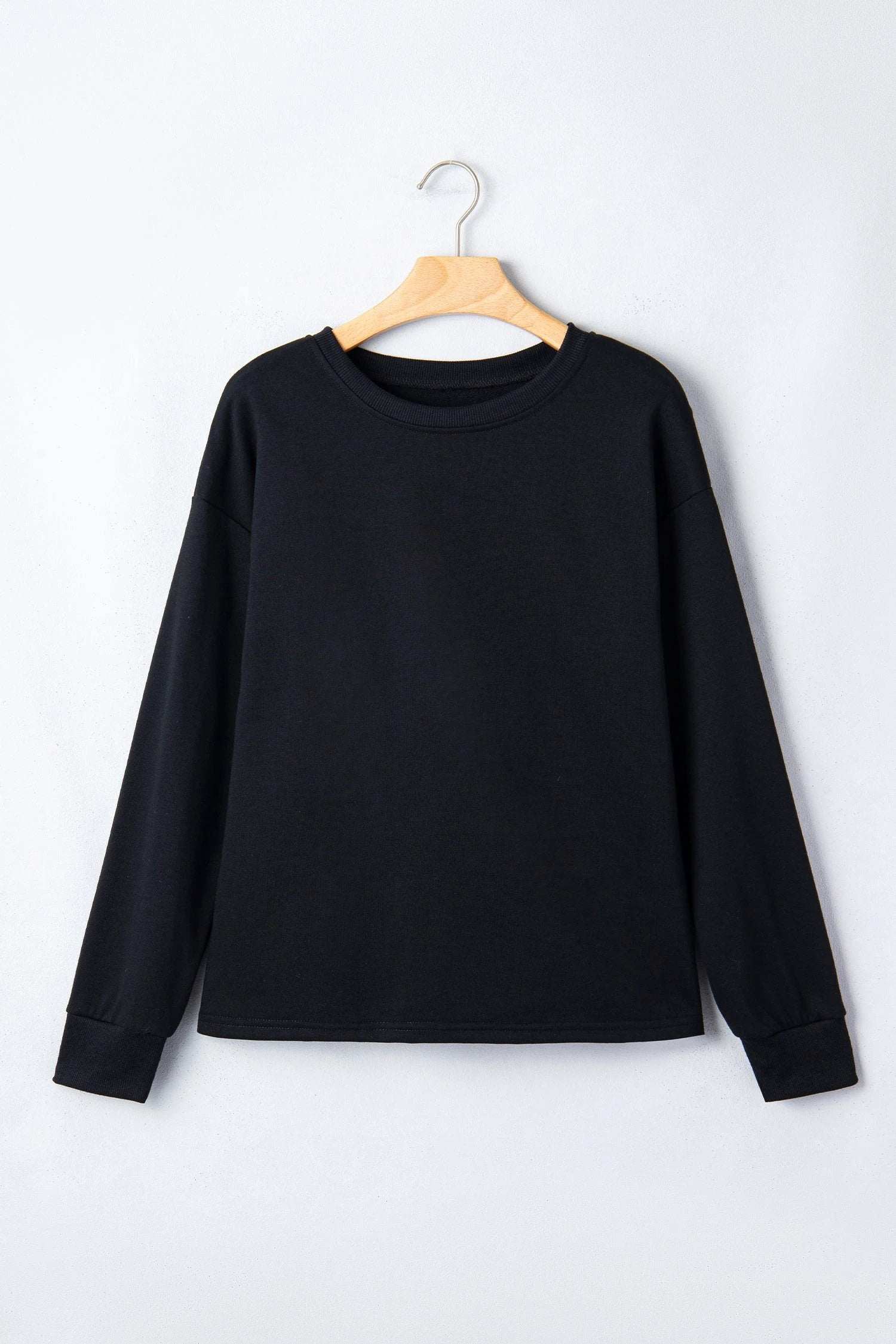 white solid color dropped shoulder long sleeve top for women casual everyday outfit