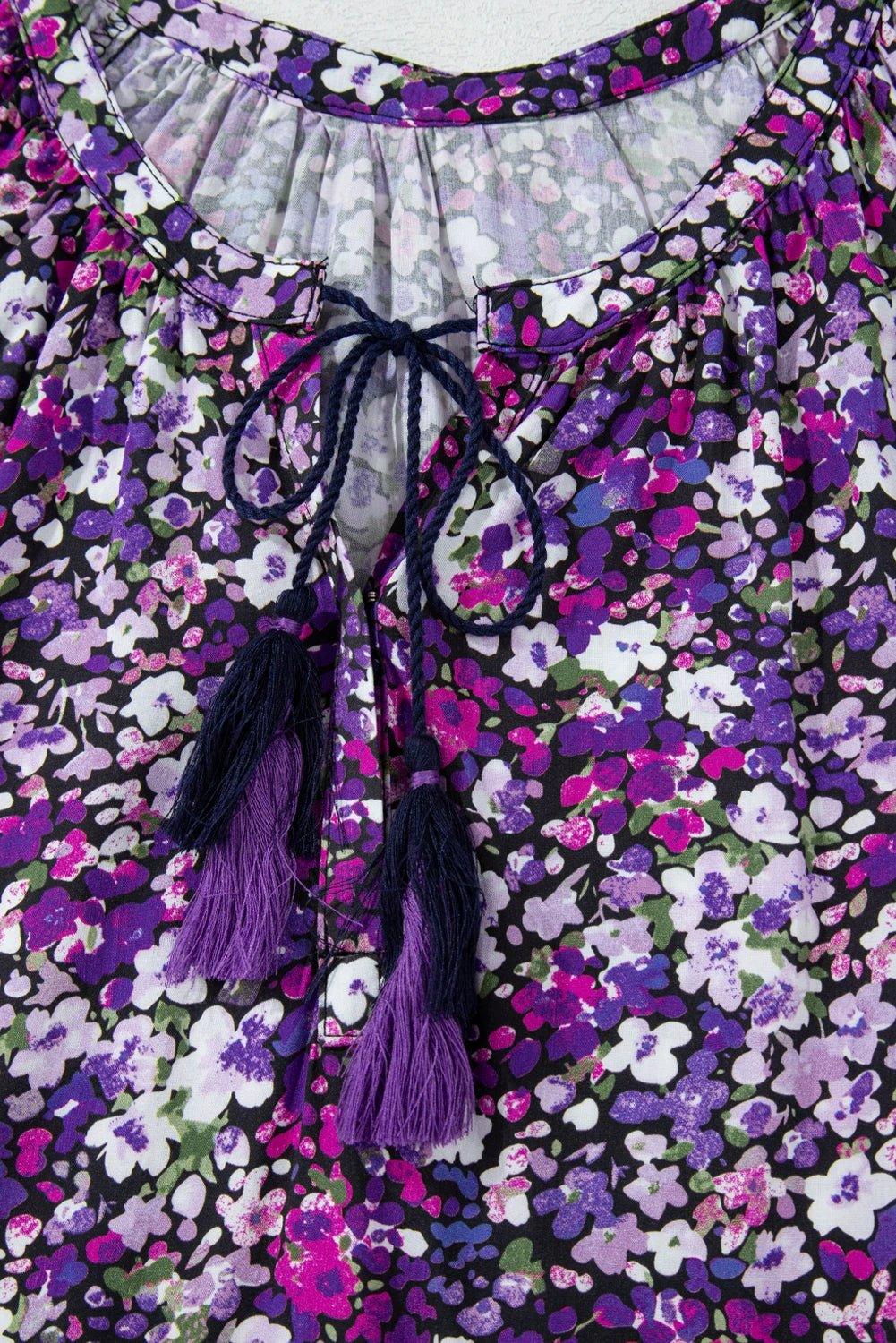 Purple floral Boho Bloom split V-neck blouse with bubble sleeves and tassel fringe hem