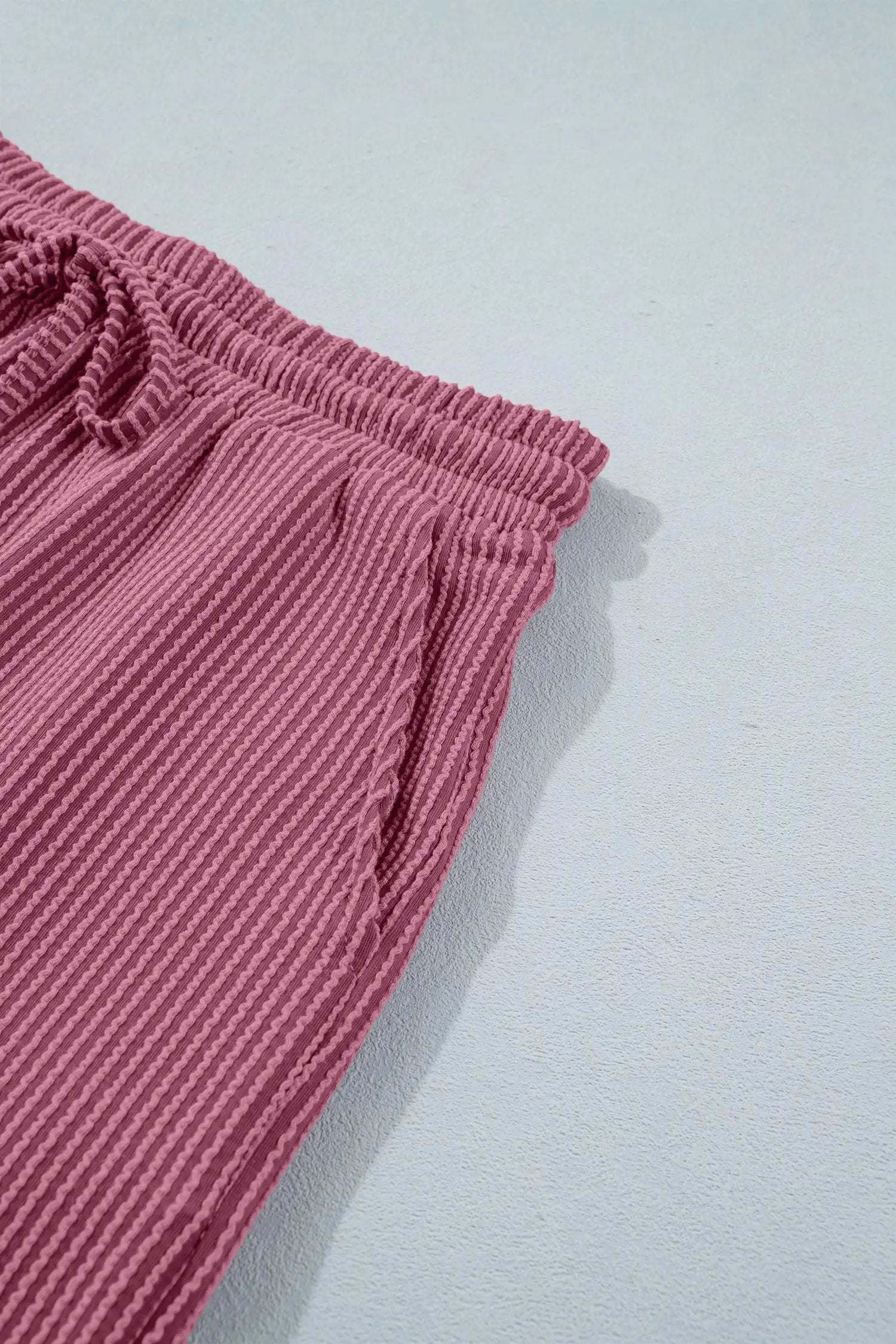 Soft pink twisted ribbed two-piece set with loose tee and shorts for casual mom style