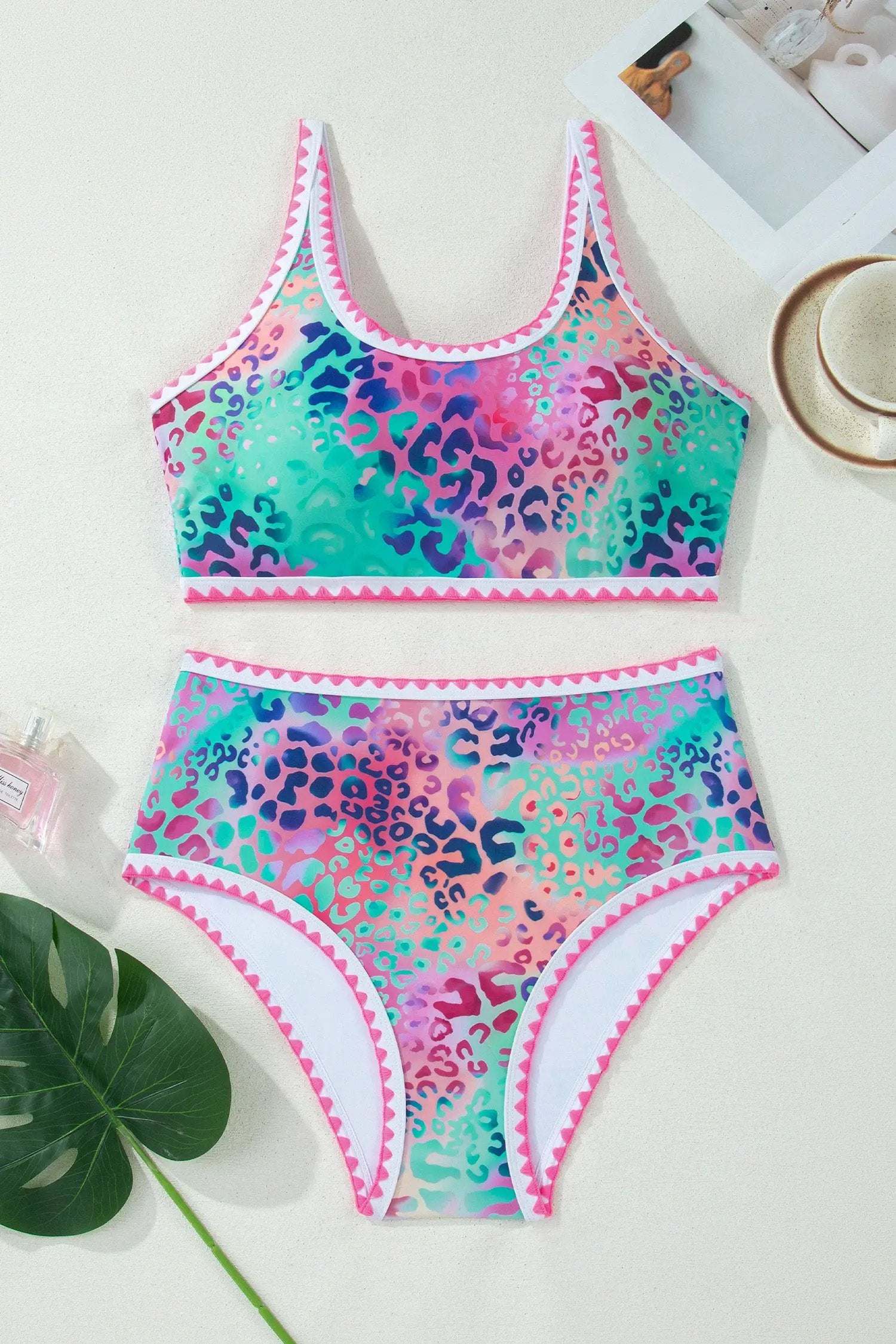 Woman wearing leopard trim high-waisted bikini set with square-neck top by poolside