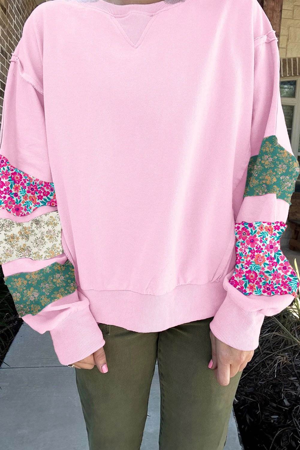 Plus size floral patched sleeve sweatshirt with ribbed trim and relaxed fit