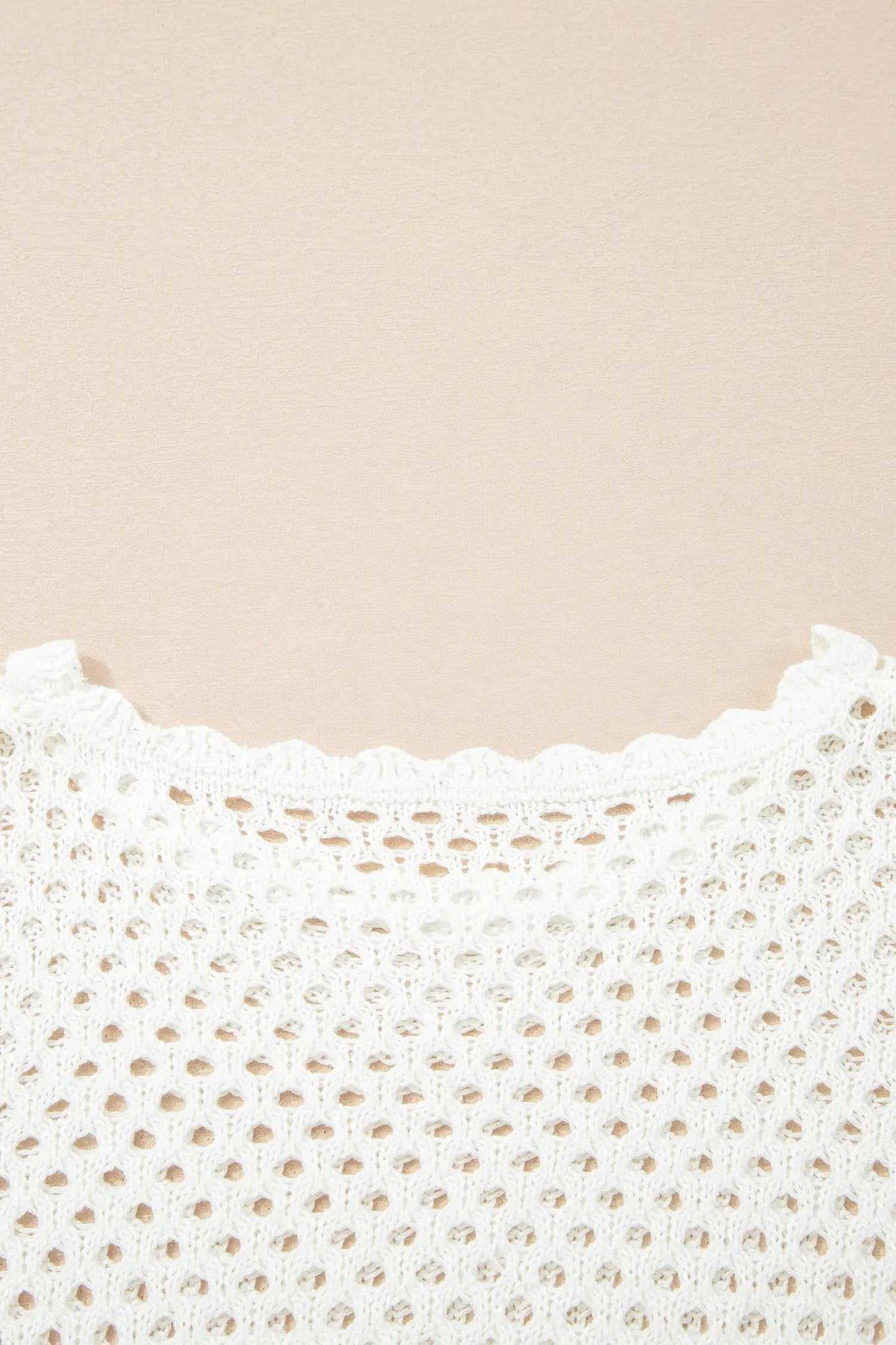 Hollow Out Knit Top with scalloped trim and long sleeves
