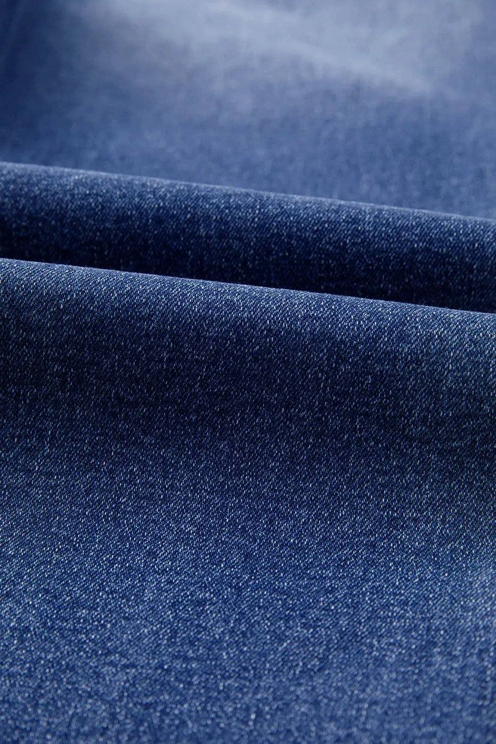 Whiskered wash cropped jeans with raw hem showcasing main character energy style