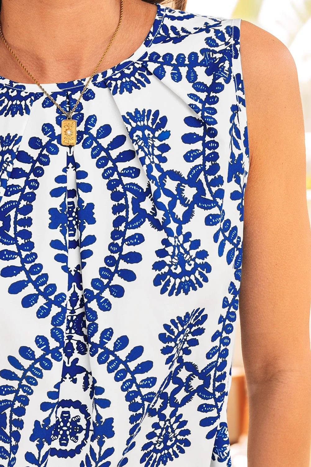 Vintage blue print pintuck tank top with crew neck, perfect for vacation vibes and casual wear