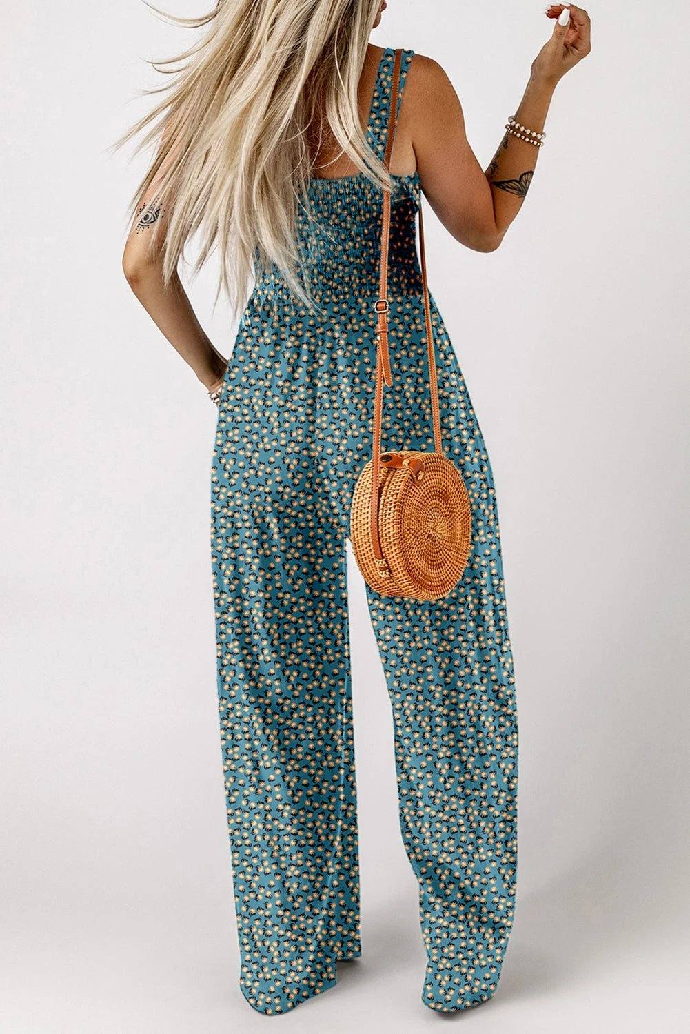 Boho Chic floral smocked square-neck jumpsuit with wide-leg silhouette and dark floral print