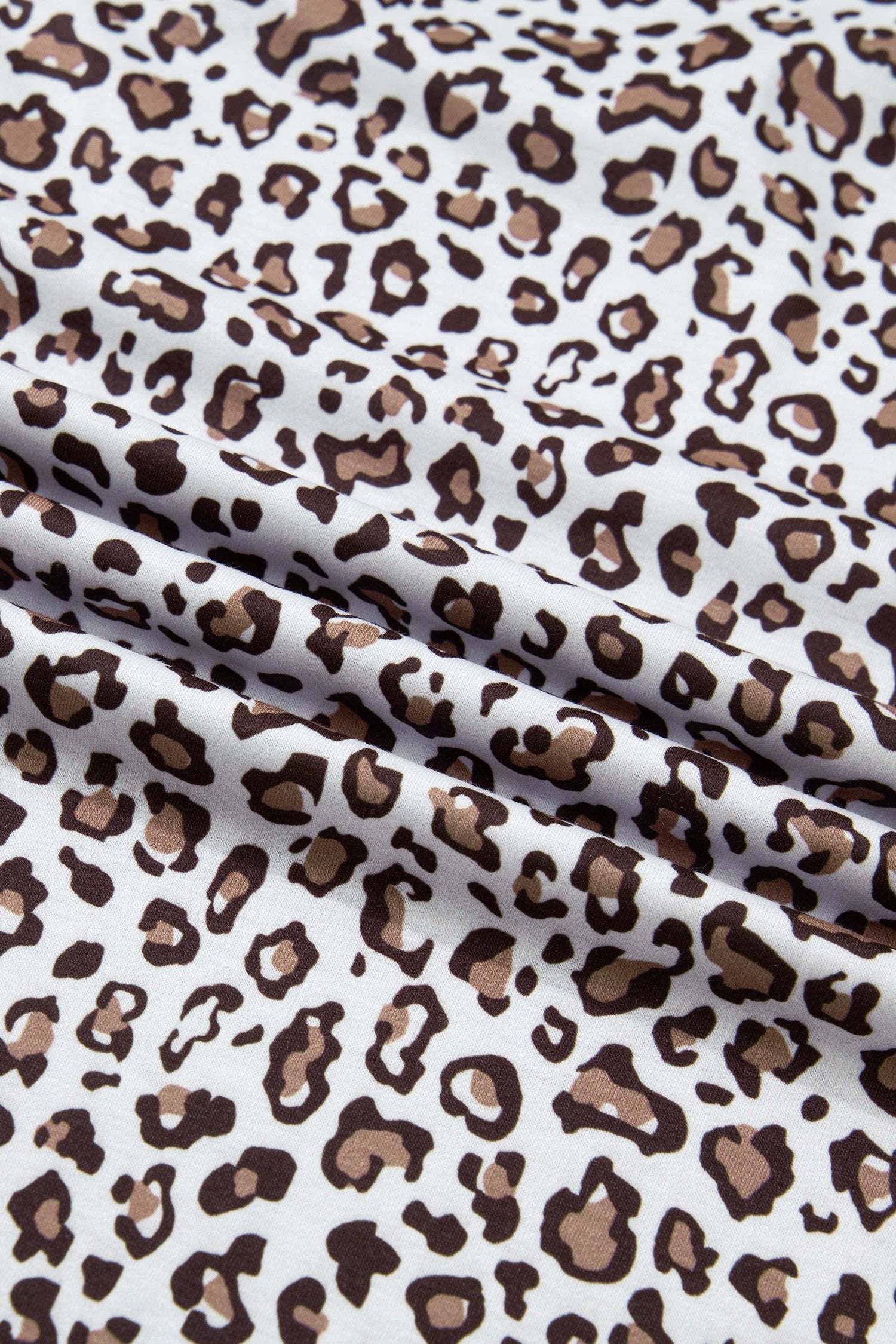 Plus size leopard sleeveless top with khaki contrast trim and relaxed fit for casual wear