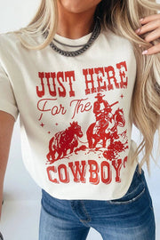 White cuffed-sleeve cowboy graphic tee with main character energy design
