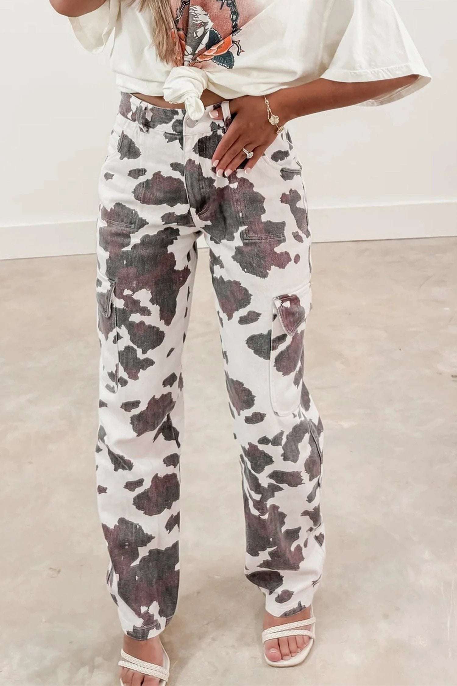 Western cow print jeans with multi pockets and tapered leg for cool mom energy look