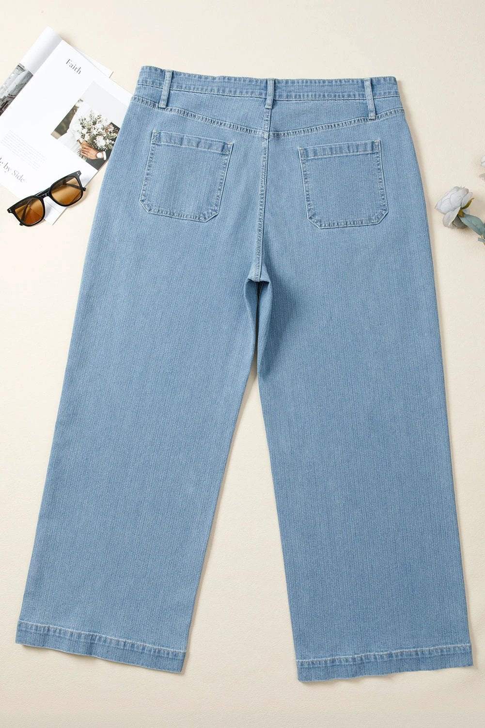 Plus size patch pocket textured wide leg jeans on model showcasing comfortable, stylish daily wear.