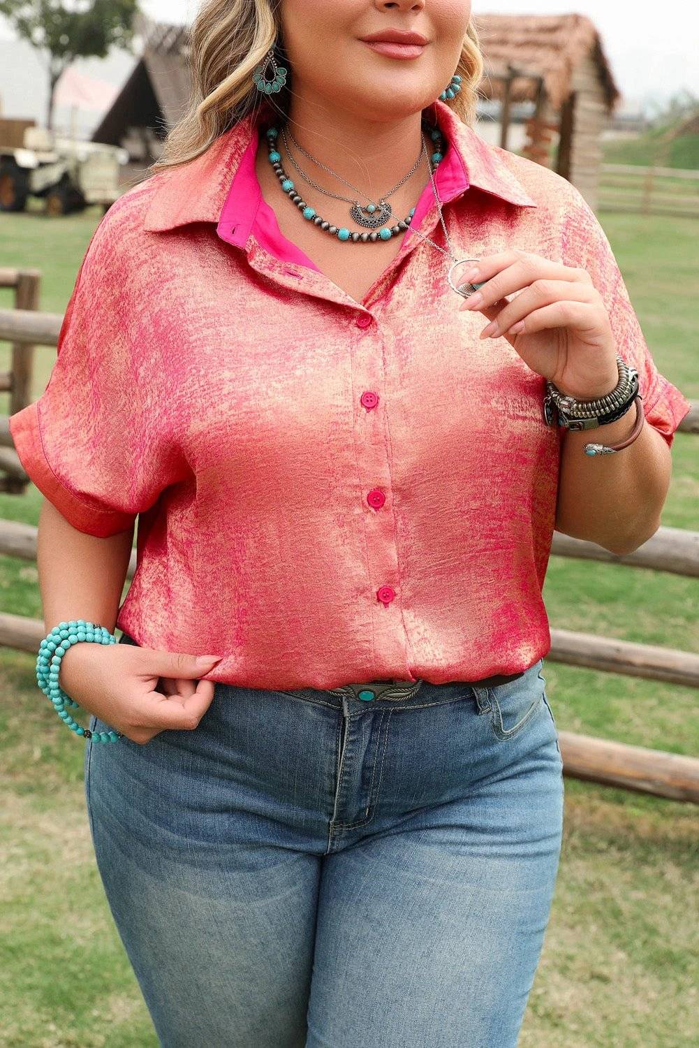 Plus size metallic sheen short sleeve pink satin button up shirt with relaxed fit and rolled cuffs