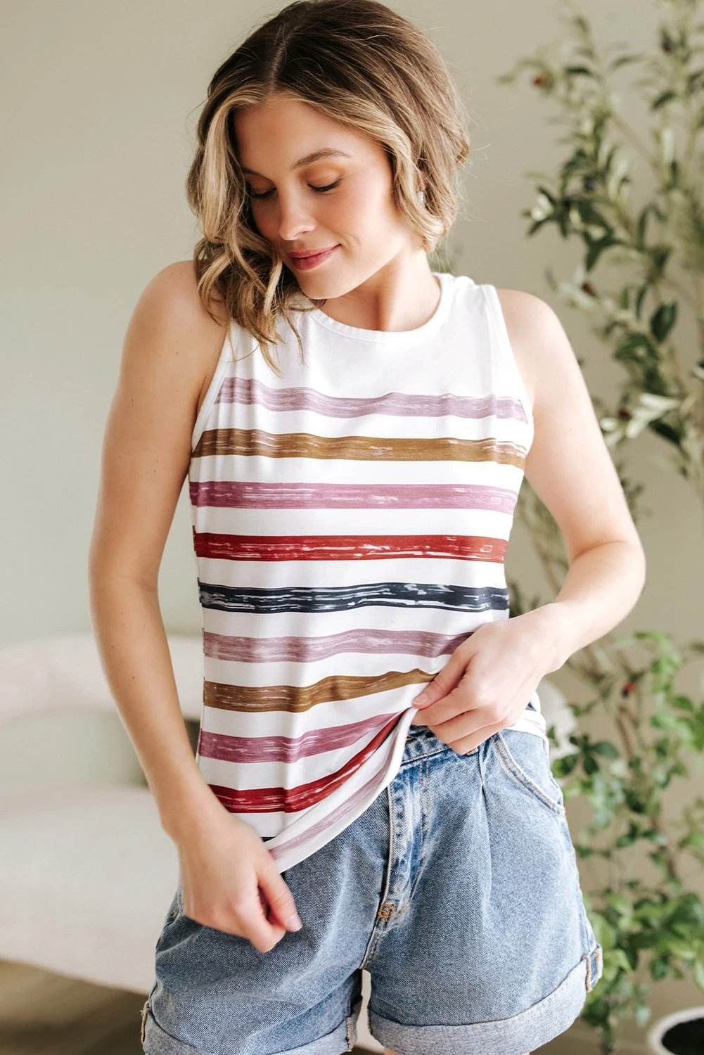 Rainbow striped round-neck tank top for moms on the go, sleeveless with relaxed fit and vibrant colors