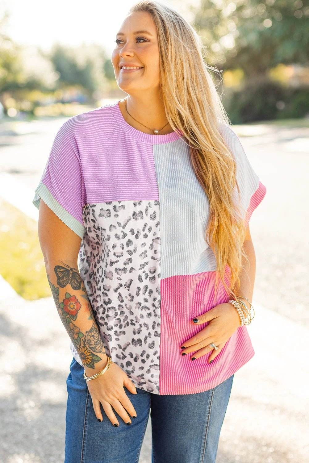 Plus size patchwork leopard knit corded tee with relaxed fit and colorblock panels