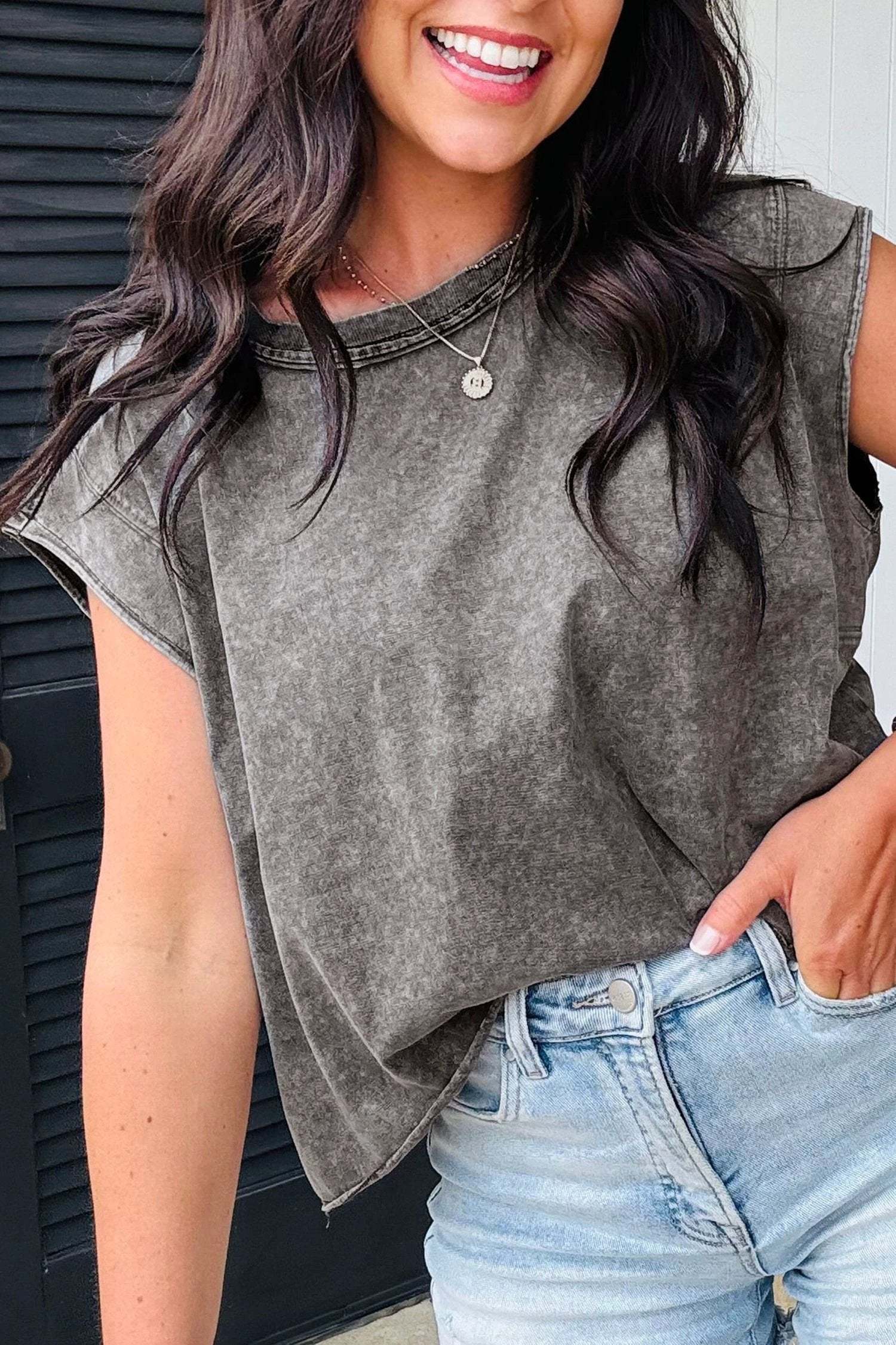 Woman wearing soft pink mineral-wash boxy fit cotton tank top from Glam Mom Moment collection