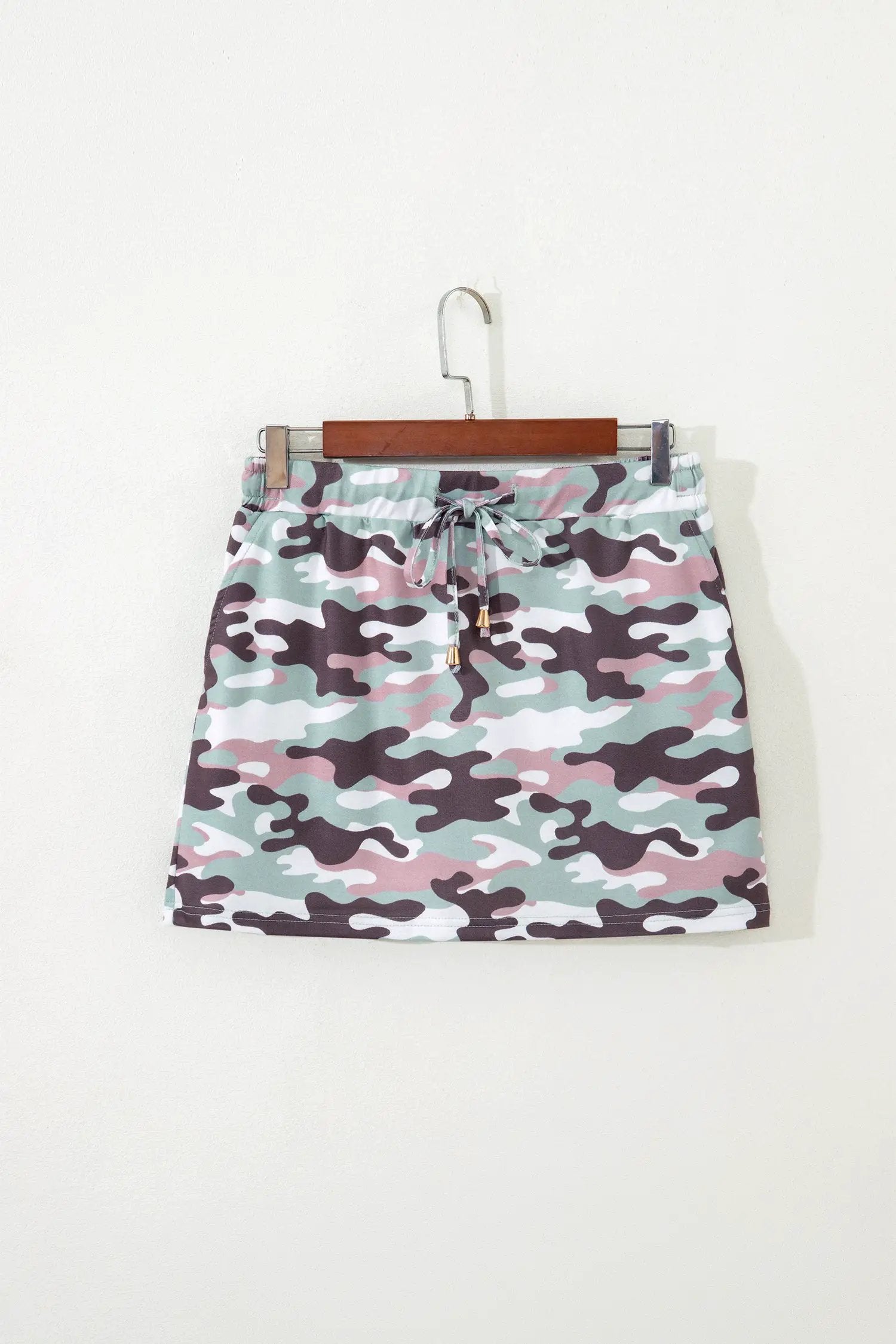 Green camouflage print drawstring mini skort with elastic waist and pastel tones for everyday confidence