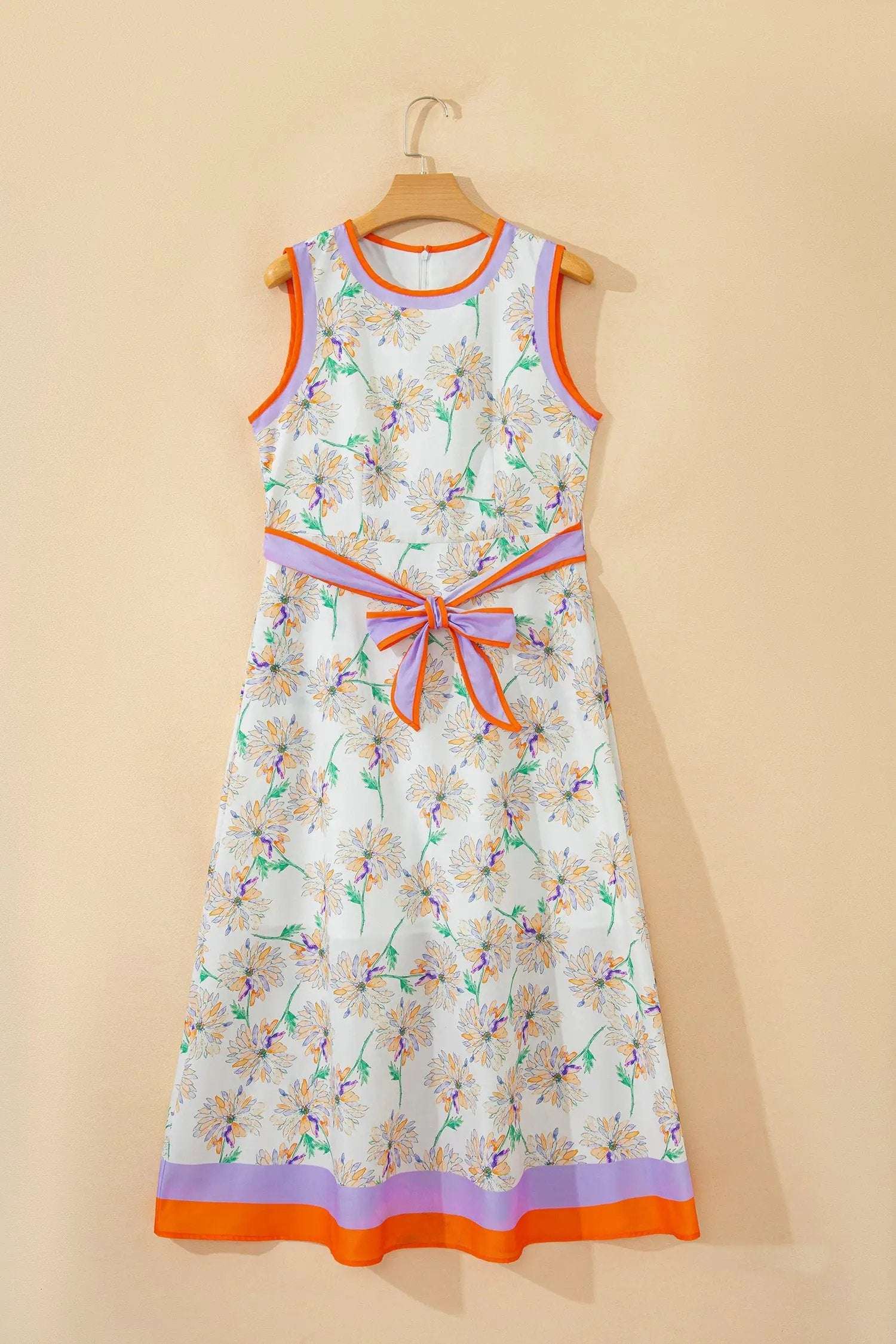 White floral print maxi dress with belted waist and color-block trim for garden parties