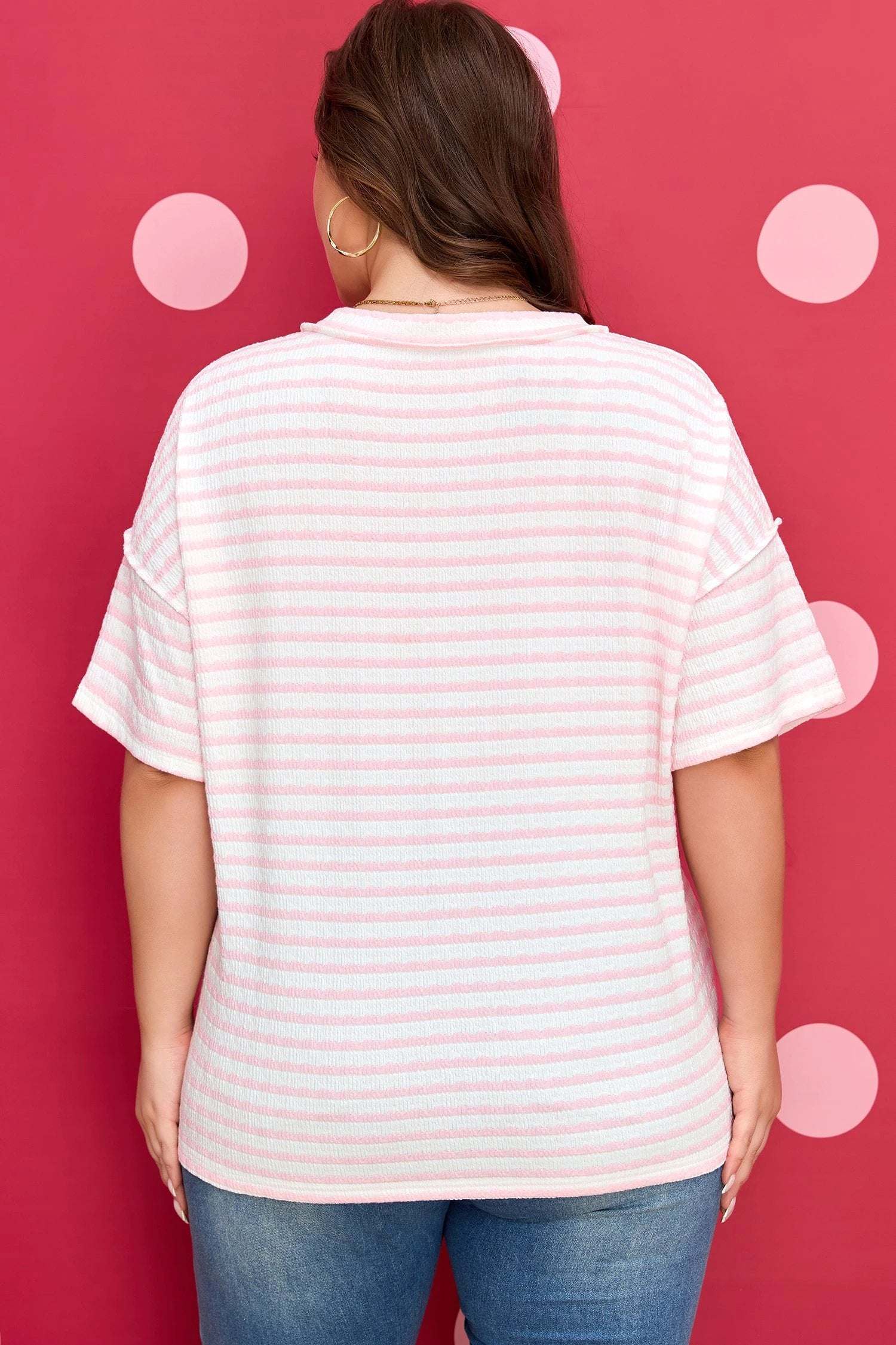 Plus size pink stripe V-neck tee with exposed seam detailing and relaxed fit