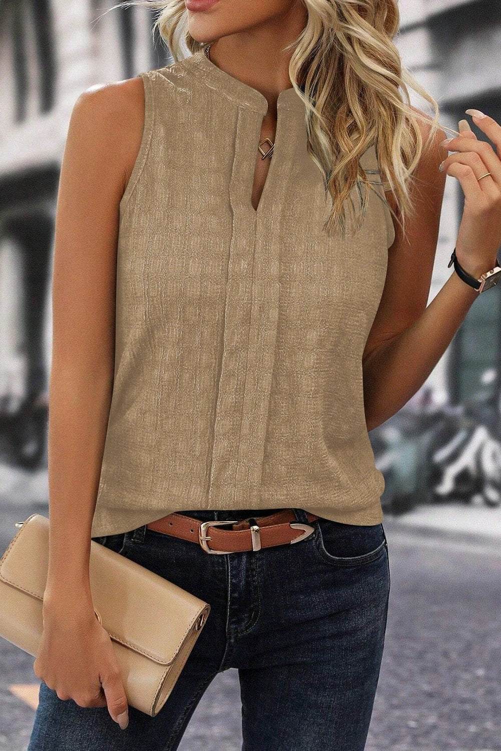 White lattice textured split-neck tank top on a hanger showcasing casual, breathable fabric for effortless style