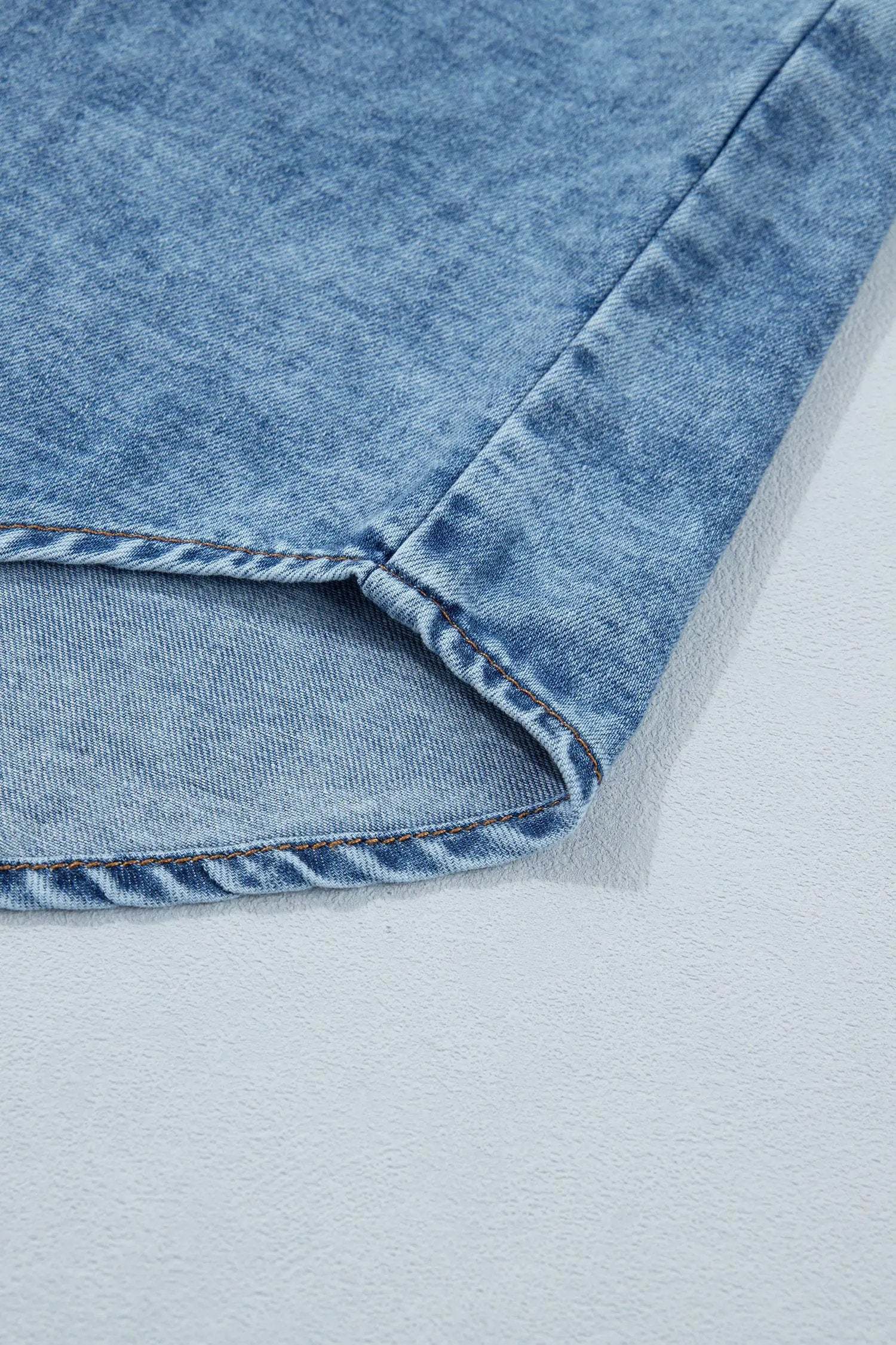 Sleeveless Western chic buttoned front collared denim top in soft blue wash