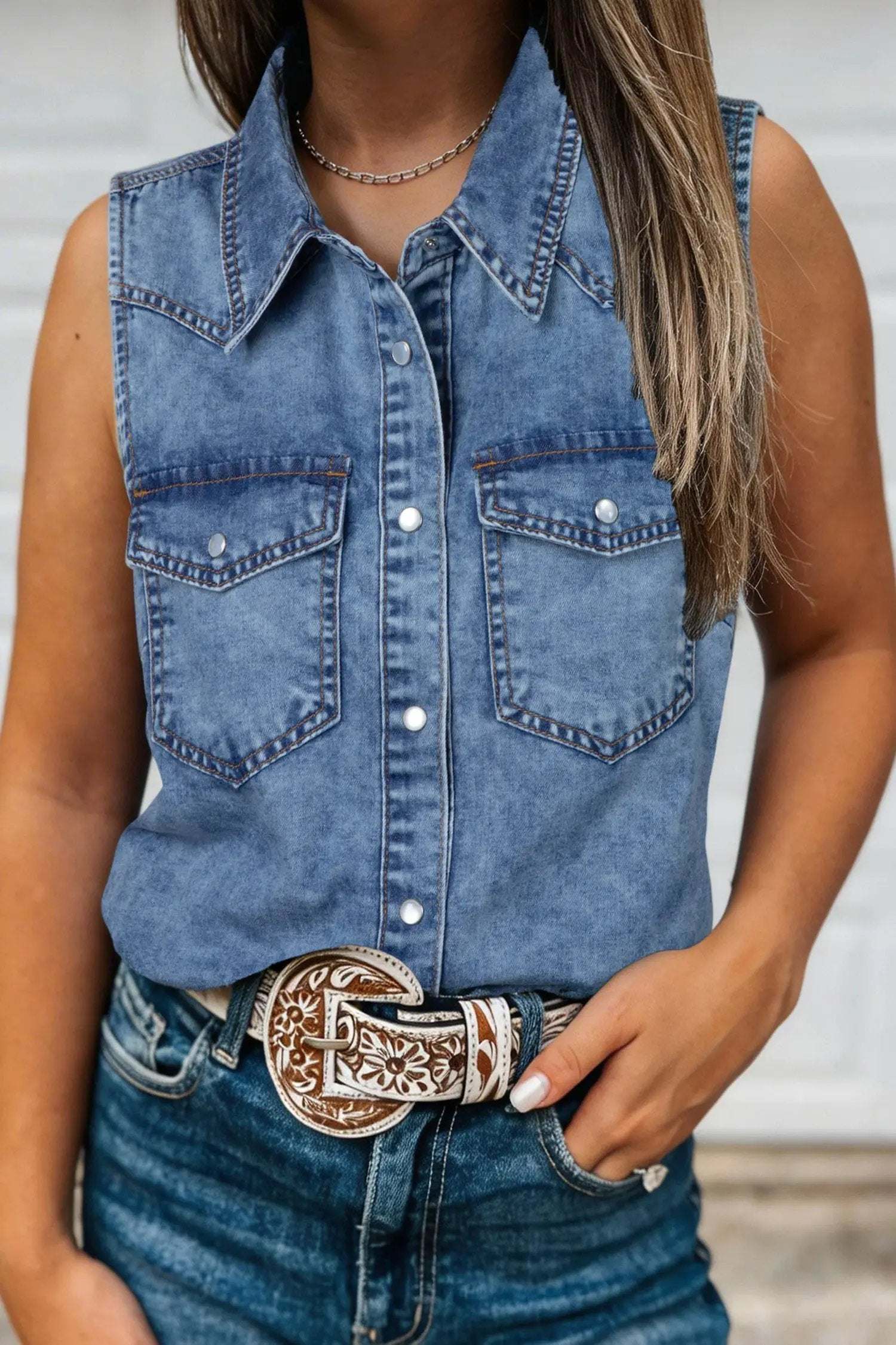 Sleeveless buttoned front collared denim top in soft blue with Western Chic style