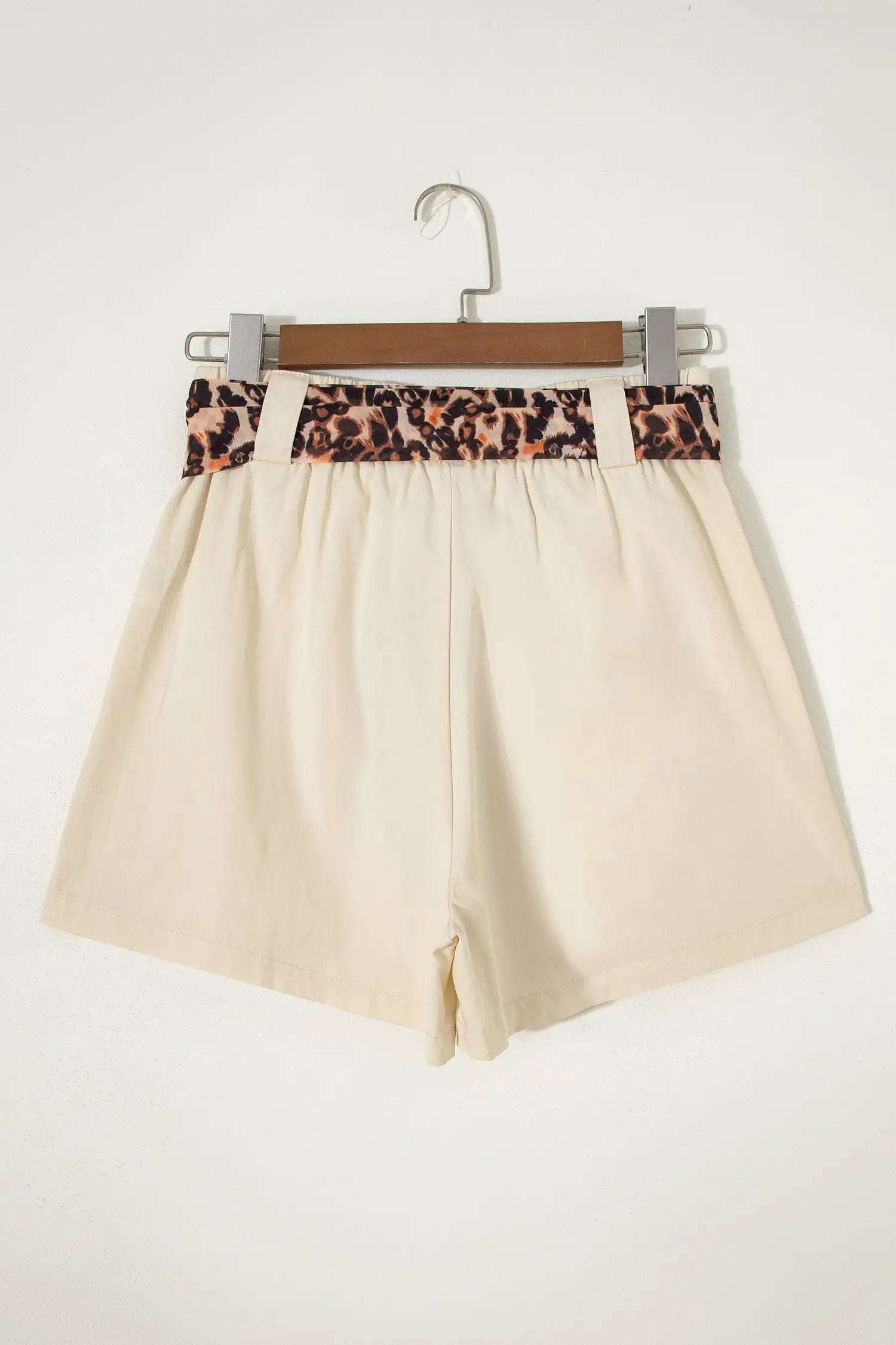 Pink pleated wide-leg shorts with leopard contrast sash belt for Weekend Vibe style