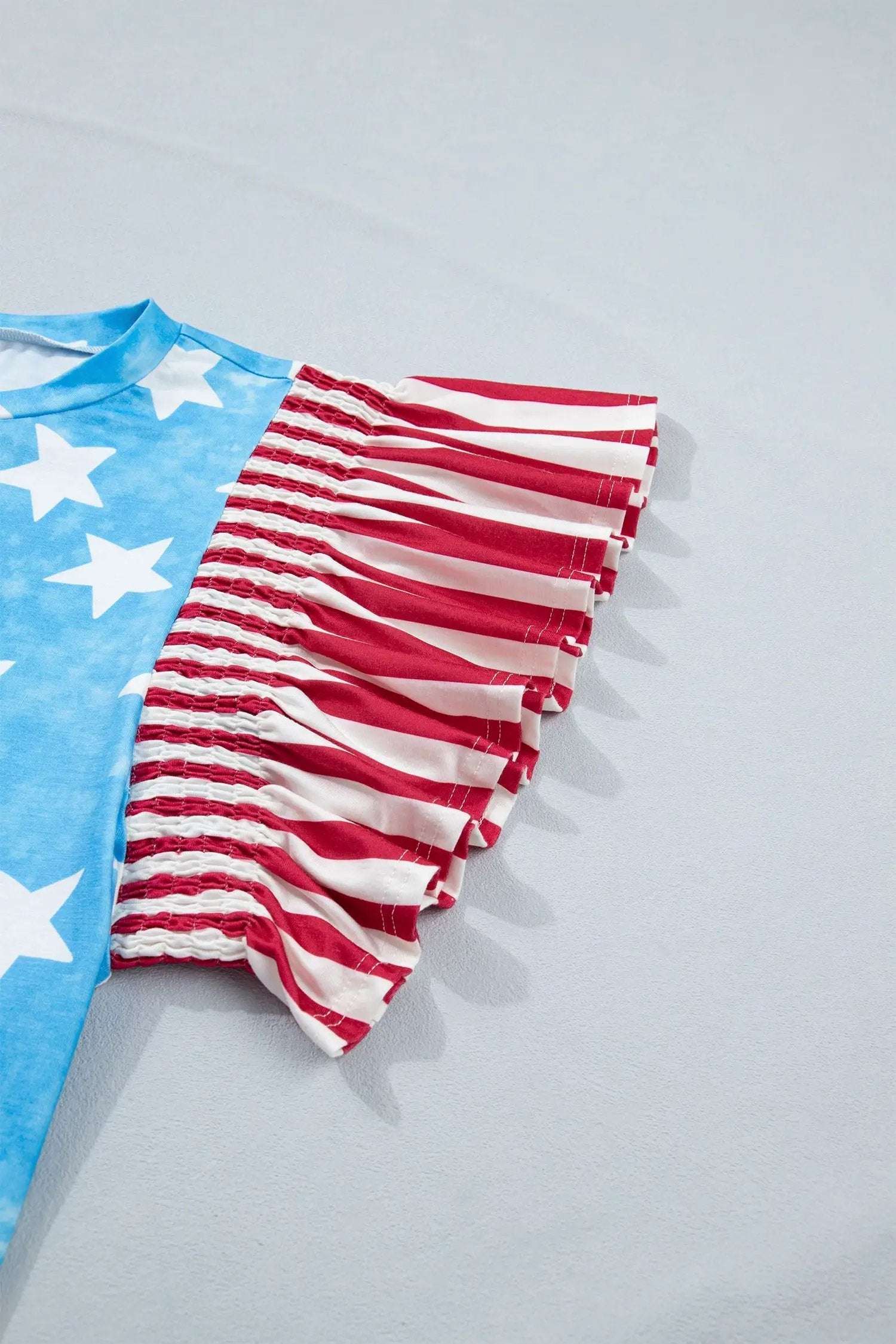 Patriotic Ruffle Sleeve Top with star print striped detail and ruffle sleeves