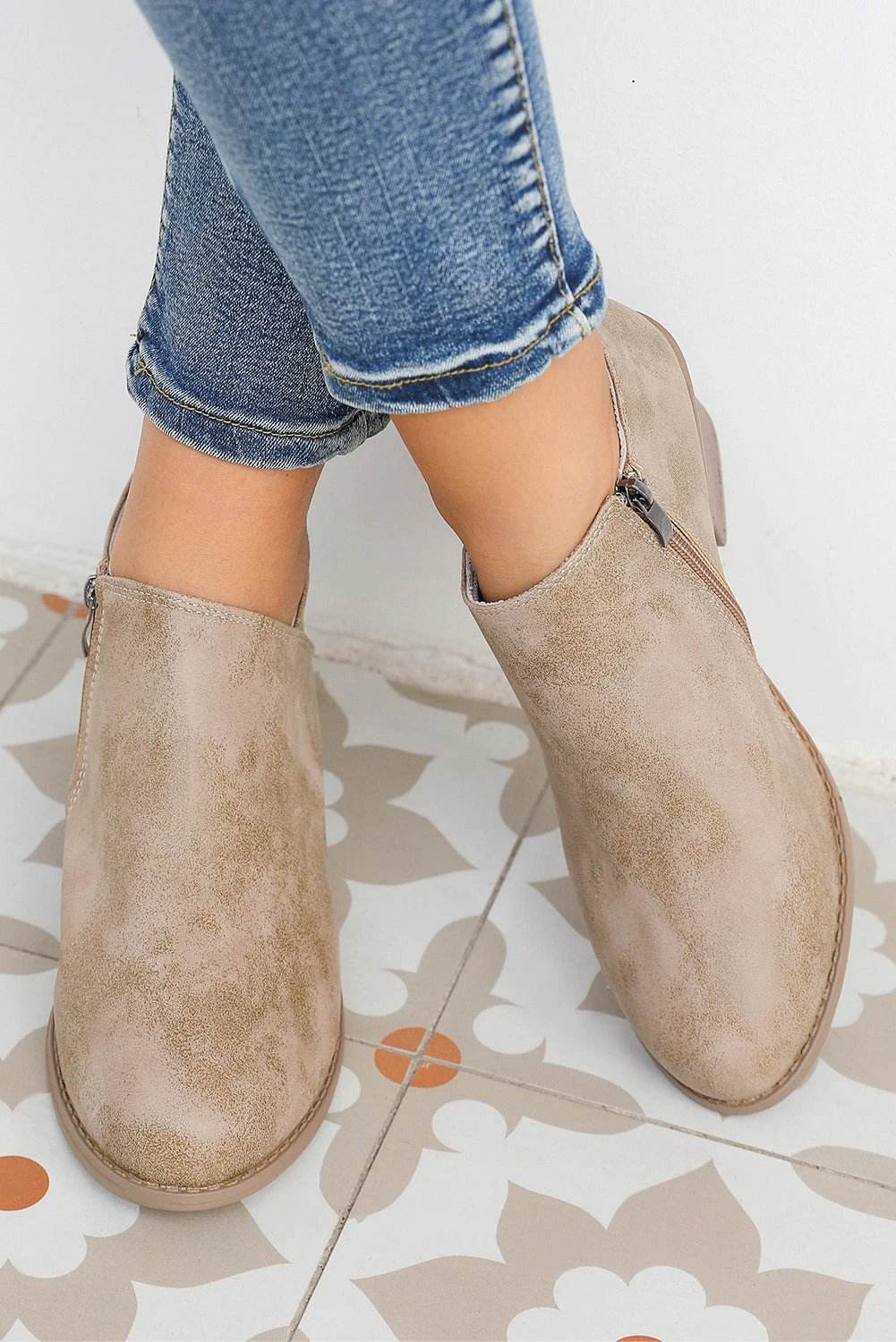 Philippine Gray Tulip opening suede ankle boots with tulip-cut silhouette and side zipper on a white background