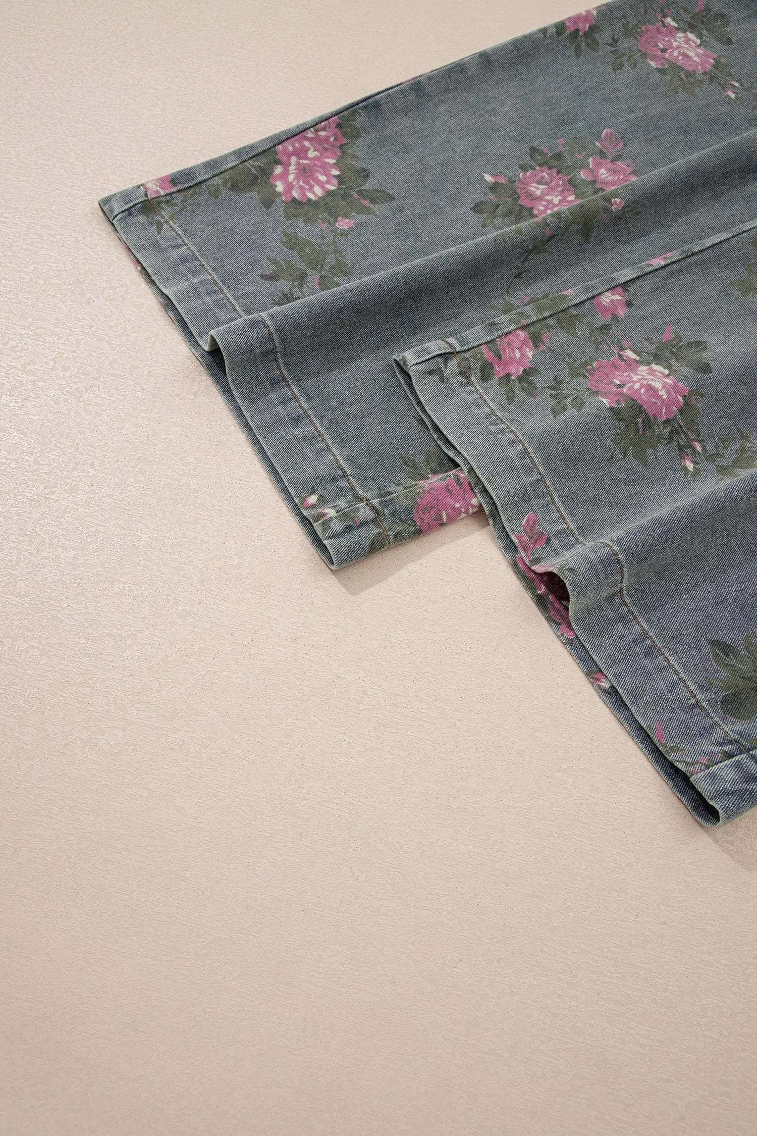 Floral Denim Jumpsuit with pleated high-waist and wide-leg silhouette