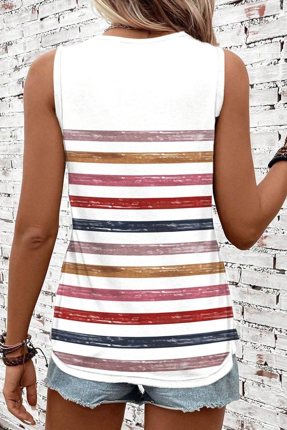Woman wearing rainbow striped round-neck tank top for casual moms on the go style