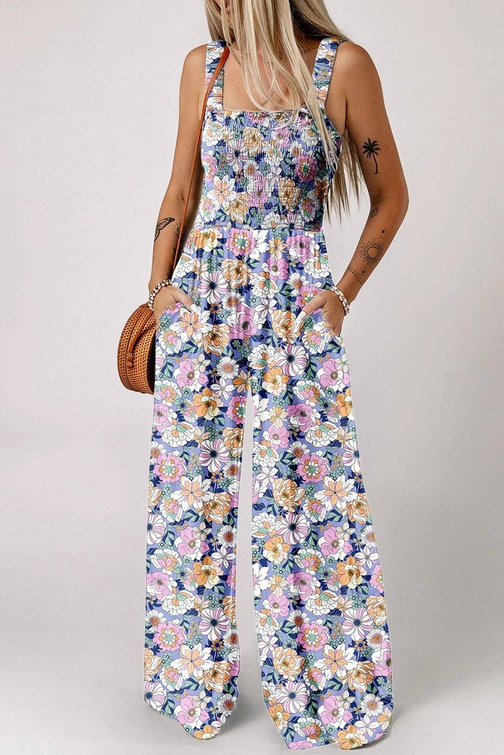 Boho Chic floral smocked square-neck jumpsuit with wide-leg silhouette and dark floral print