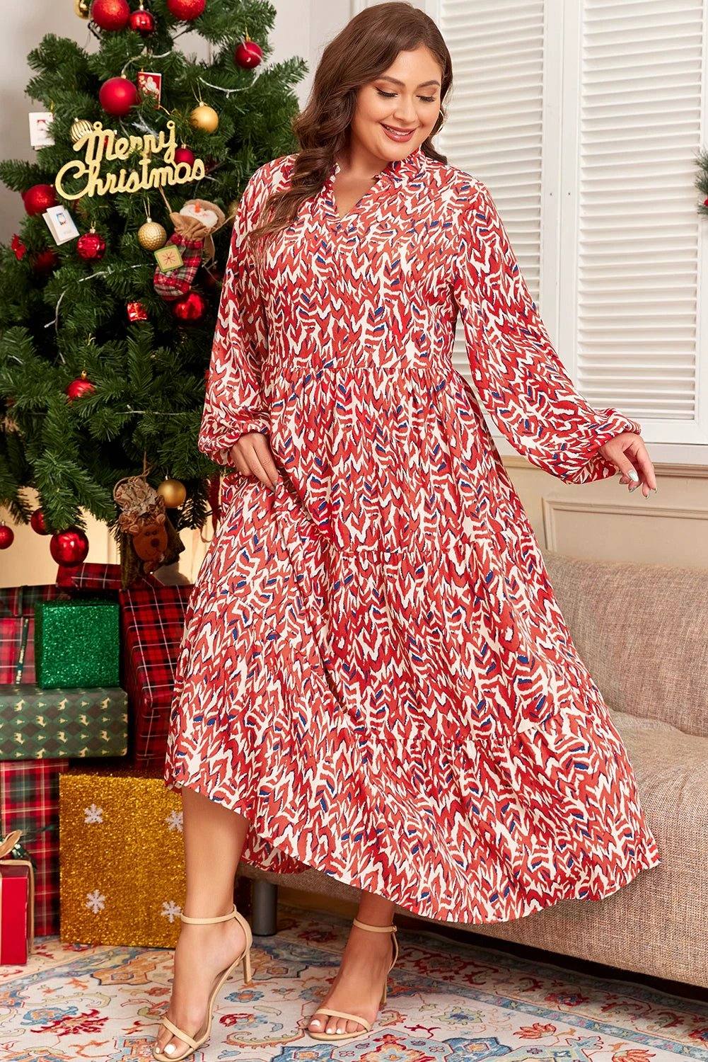 Plus size abstract print notch V-neck high waist maxi dress with long puff sleeves and vibrant red pattern