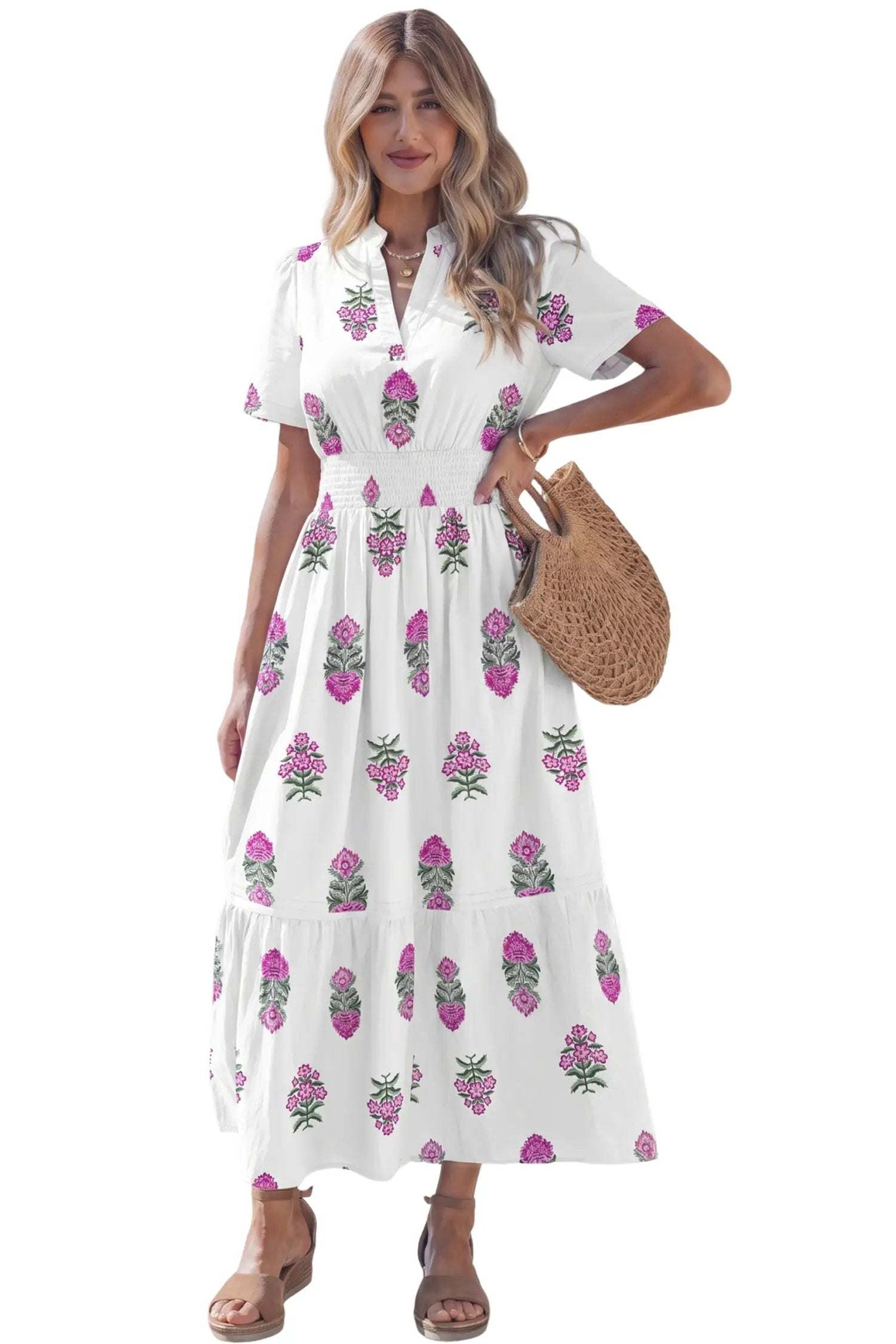 Woman wearing a floral print split neck maxi dress with shirred waist and ruffle hem showcasing main character energy