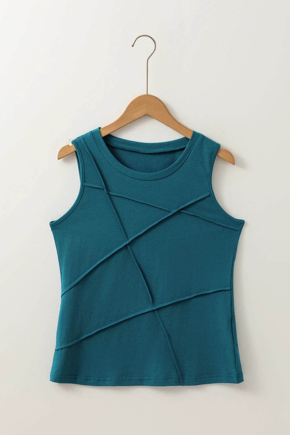 Sapphire green round neck tank top with diagonal stitching detail on relaxed fit model