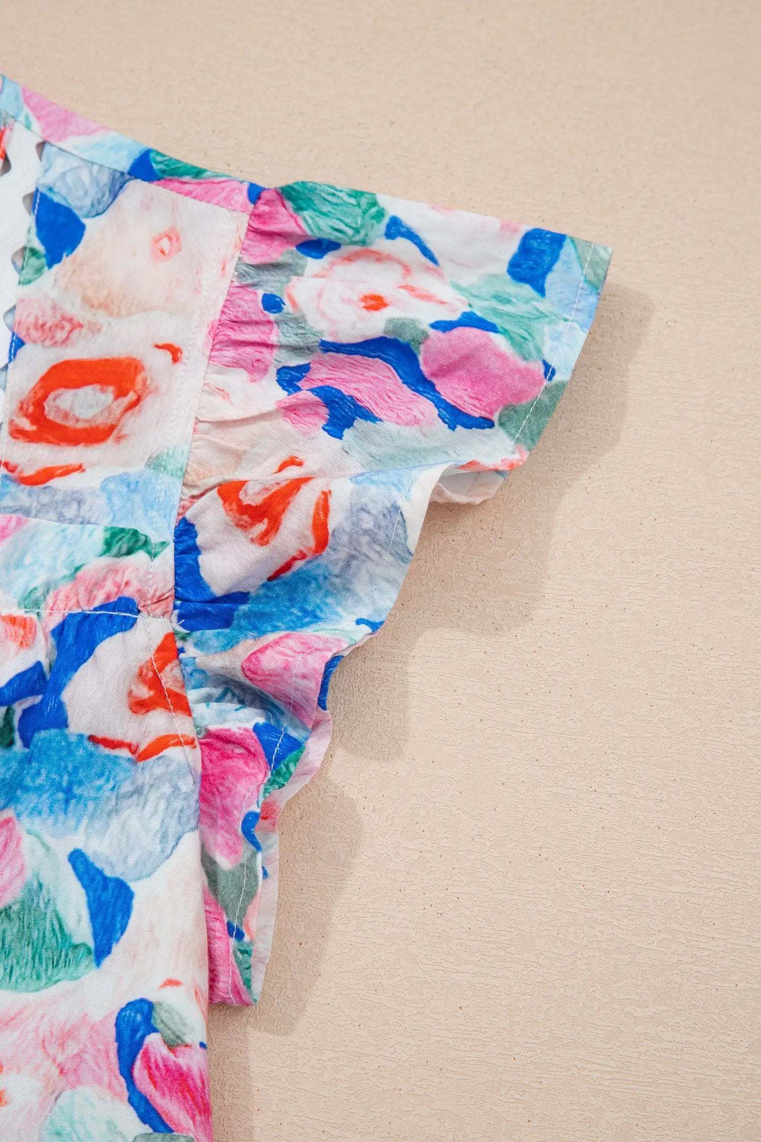 Floral print tie neck blouse with V-neck and ruffle sleeves perfect for vacation vibe